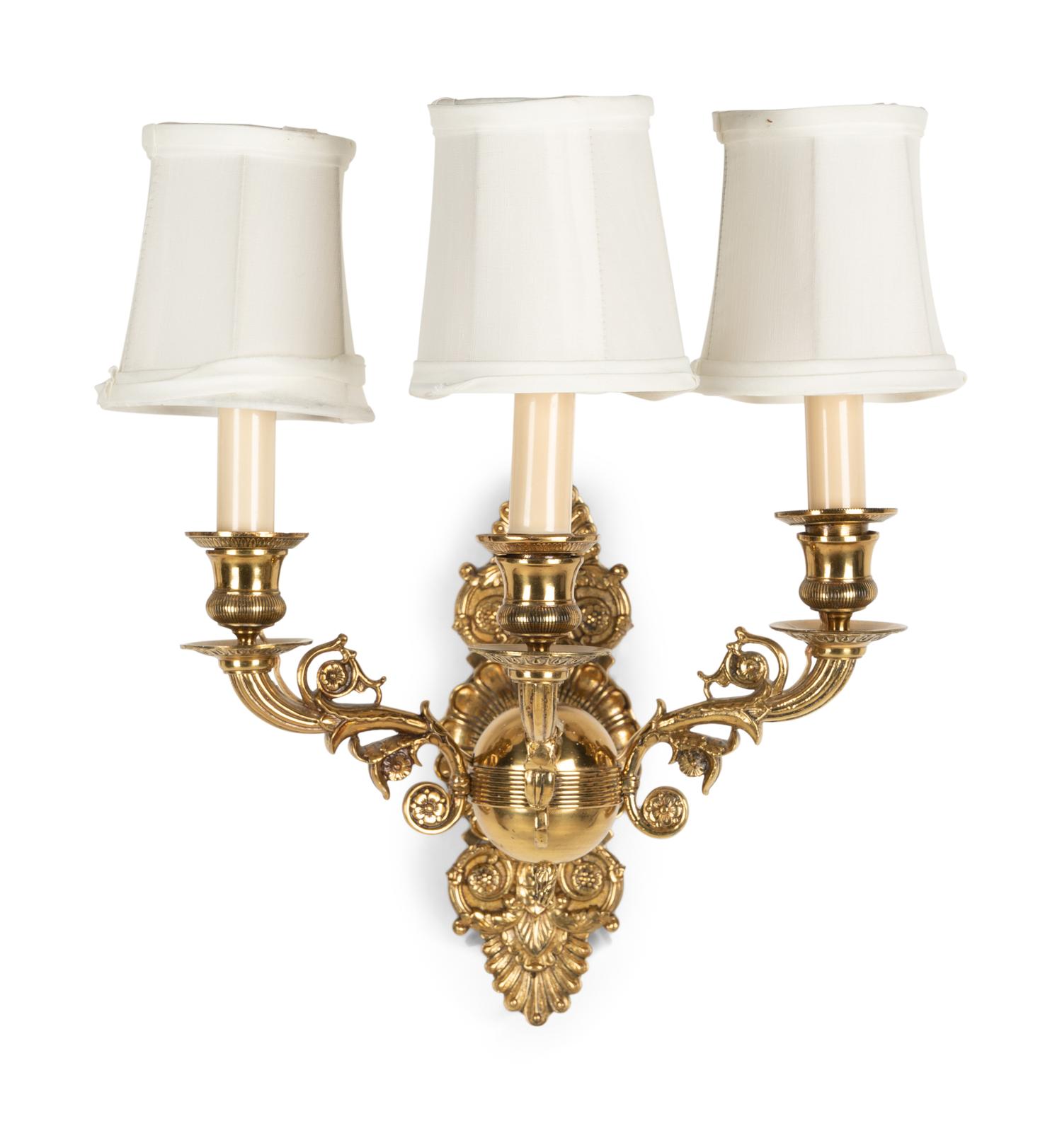A Pair of Empire Style Brass Three-Light Sconces
