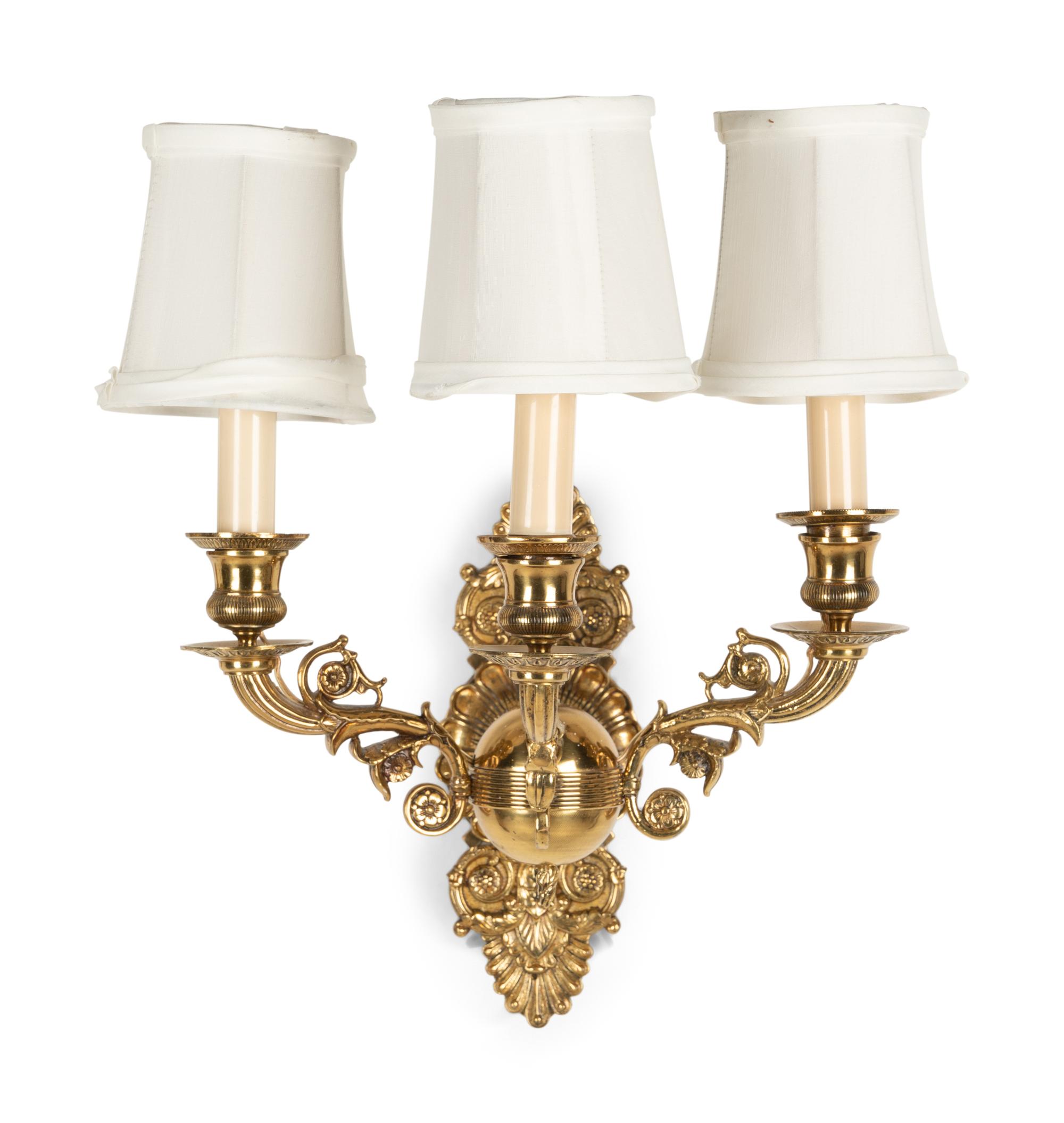 A Pair of Empire Style Brass Three-Light Sconces