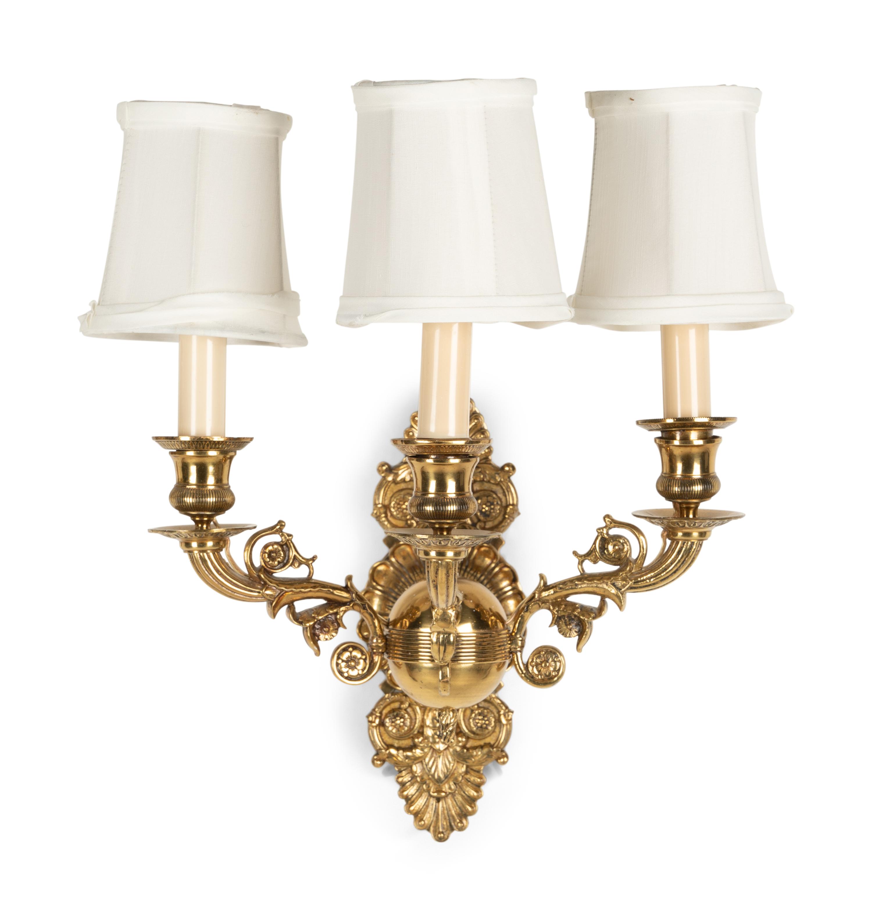 A Pair of Empire Style Brass Three-Light Sconces