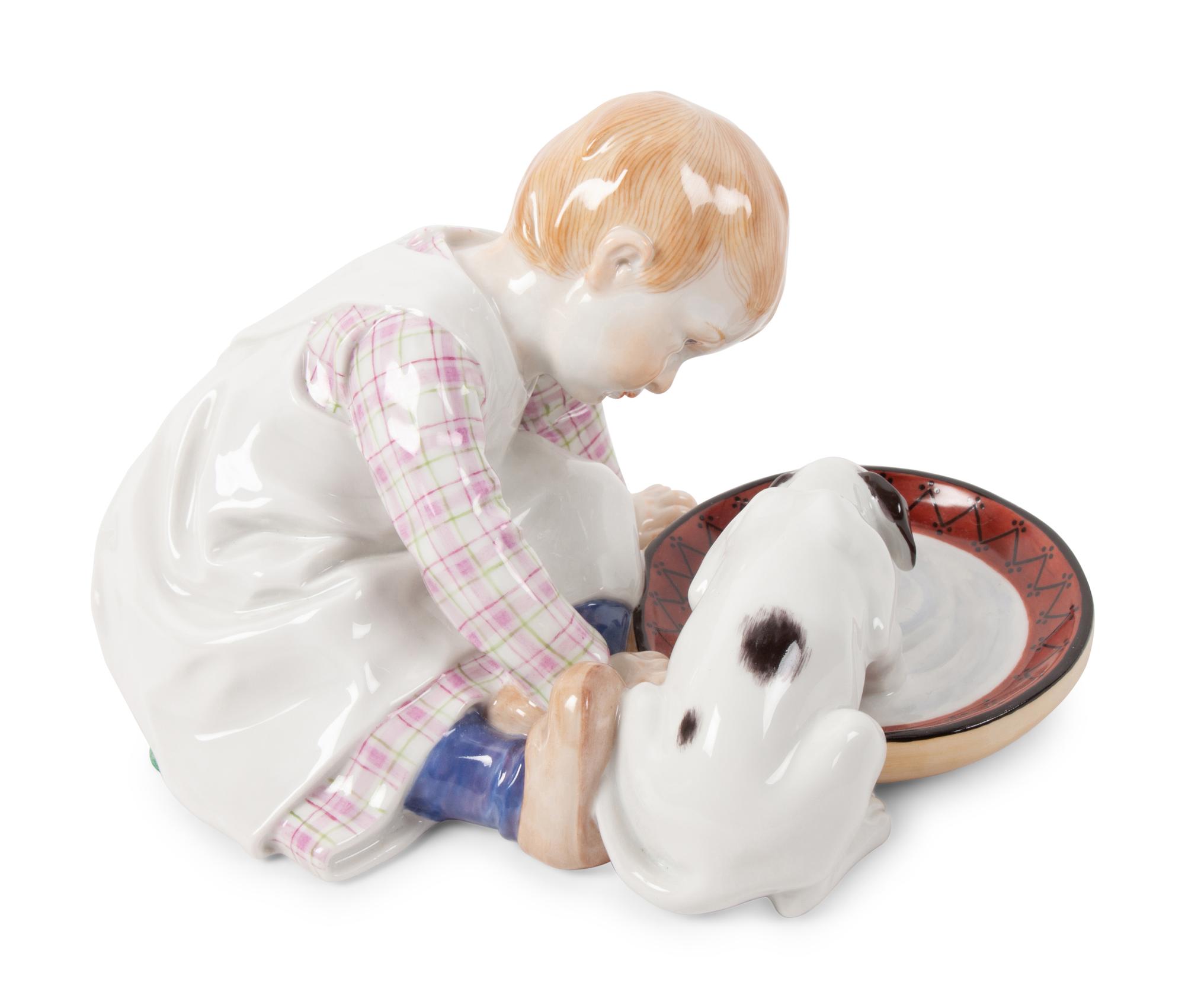 A Meissen Porcelain Figural Group of a Child Feeding Dog, by Konrad Hentschel