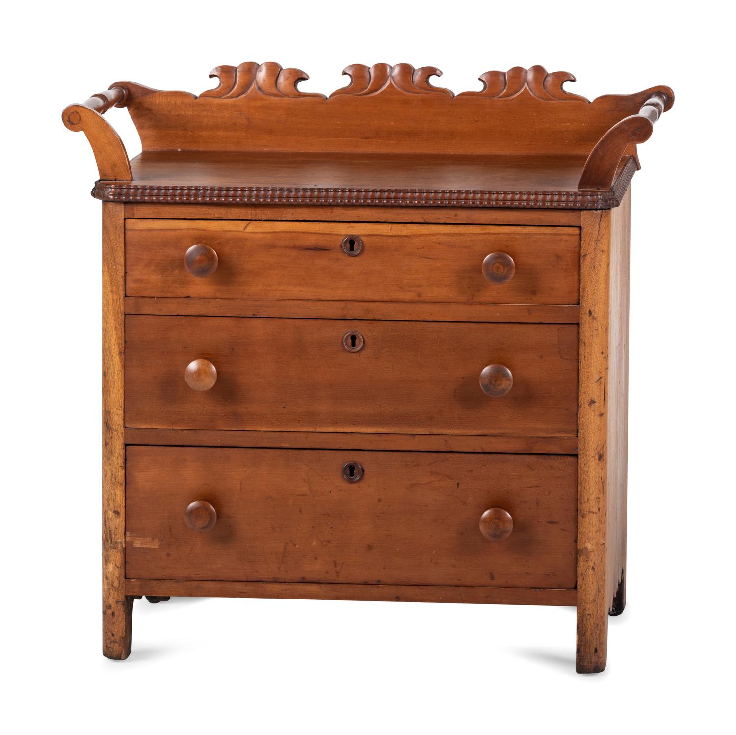A Victorian Carved Cherrywood Diminutive Chest of Drawers