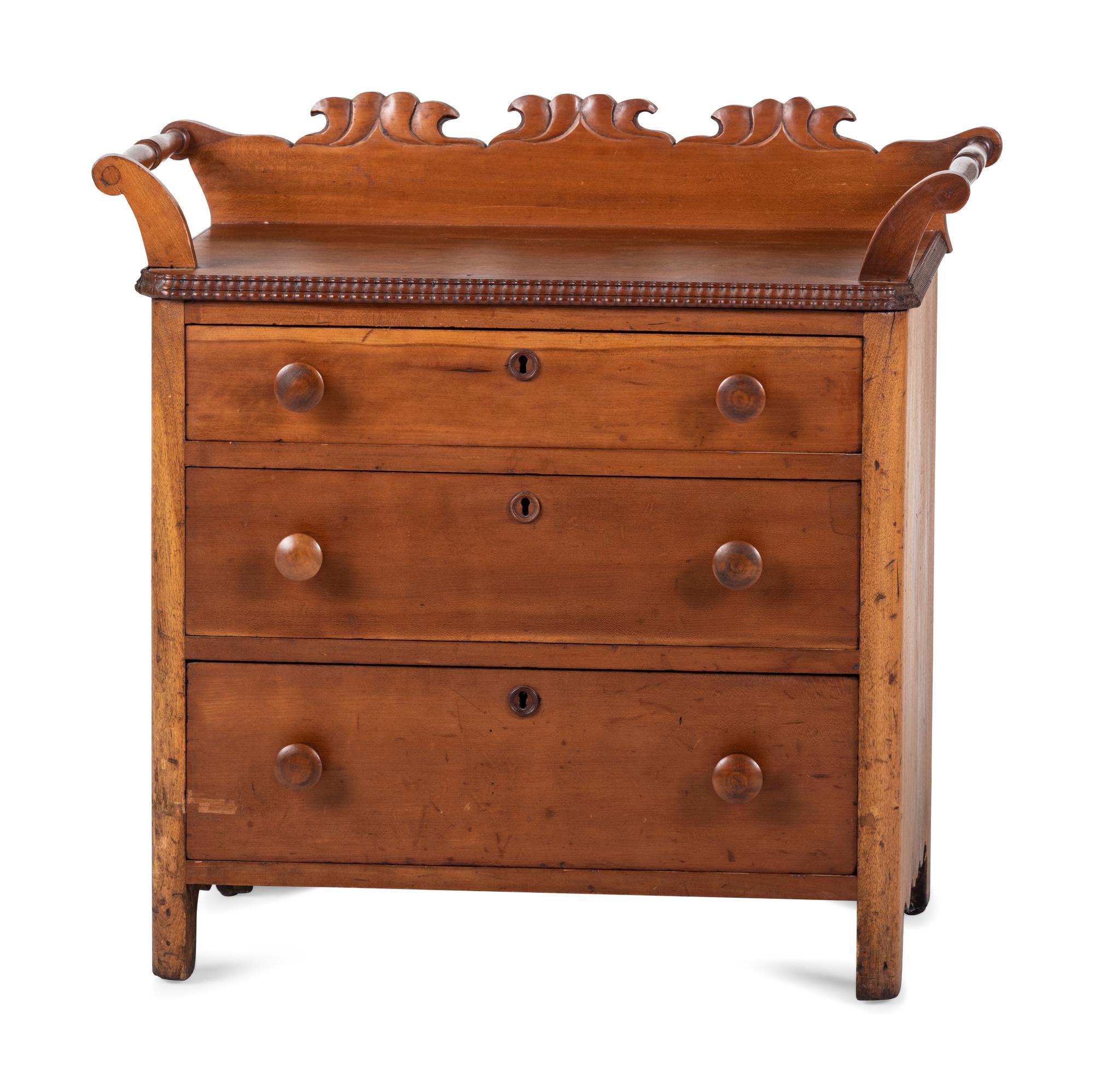 A Victorian Carved Cherrywood Diminutive Chest of Drawers