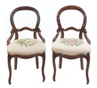 A Pair of Victorian Walnut Balloon Back Chairs Height 35 1/2 inches. — 19TH CENTURY