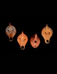 Four Roman Molded Terra Cotta Oil Lamps