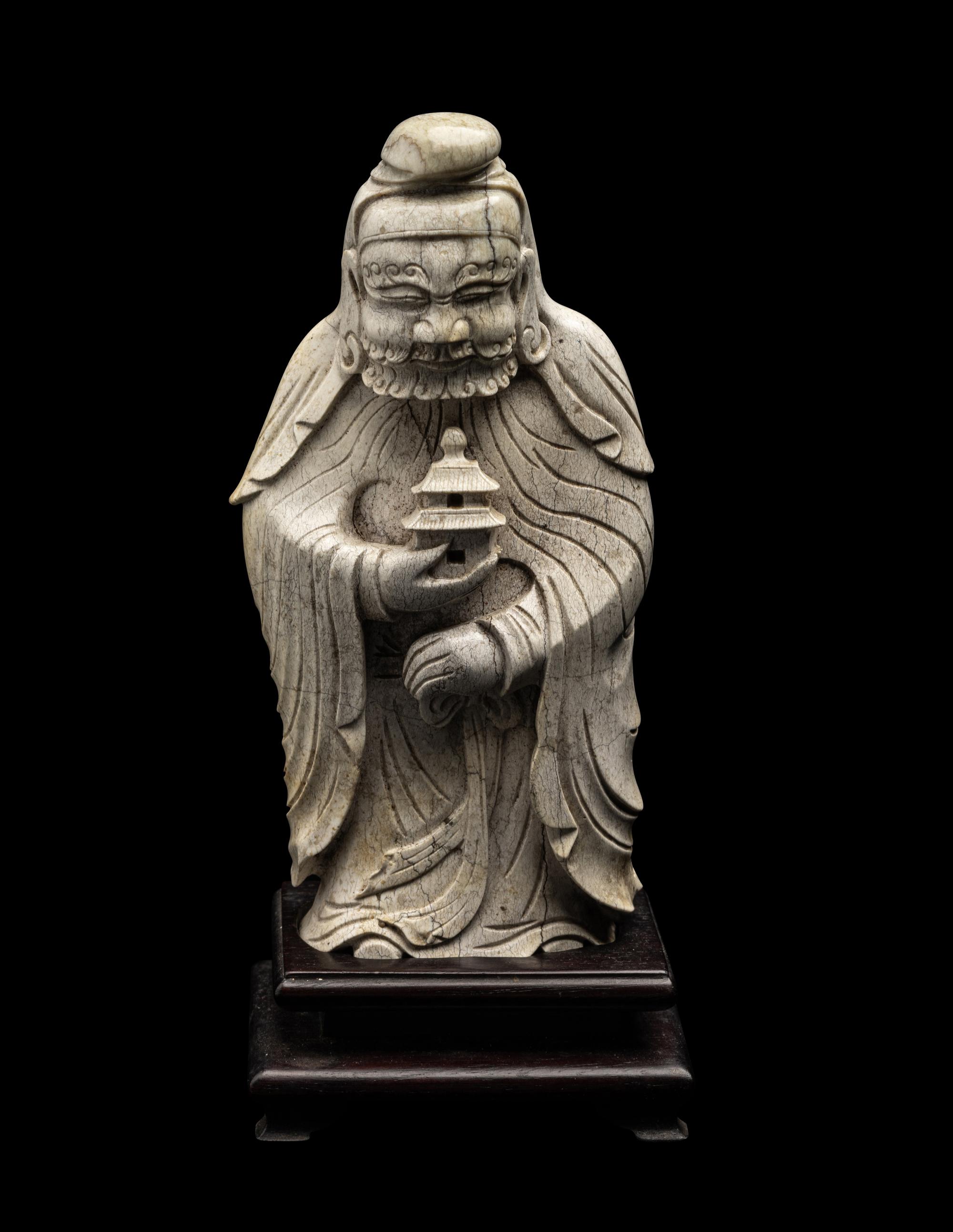 A Chinese Burnt Jade Figure of a Foreigner