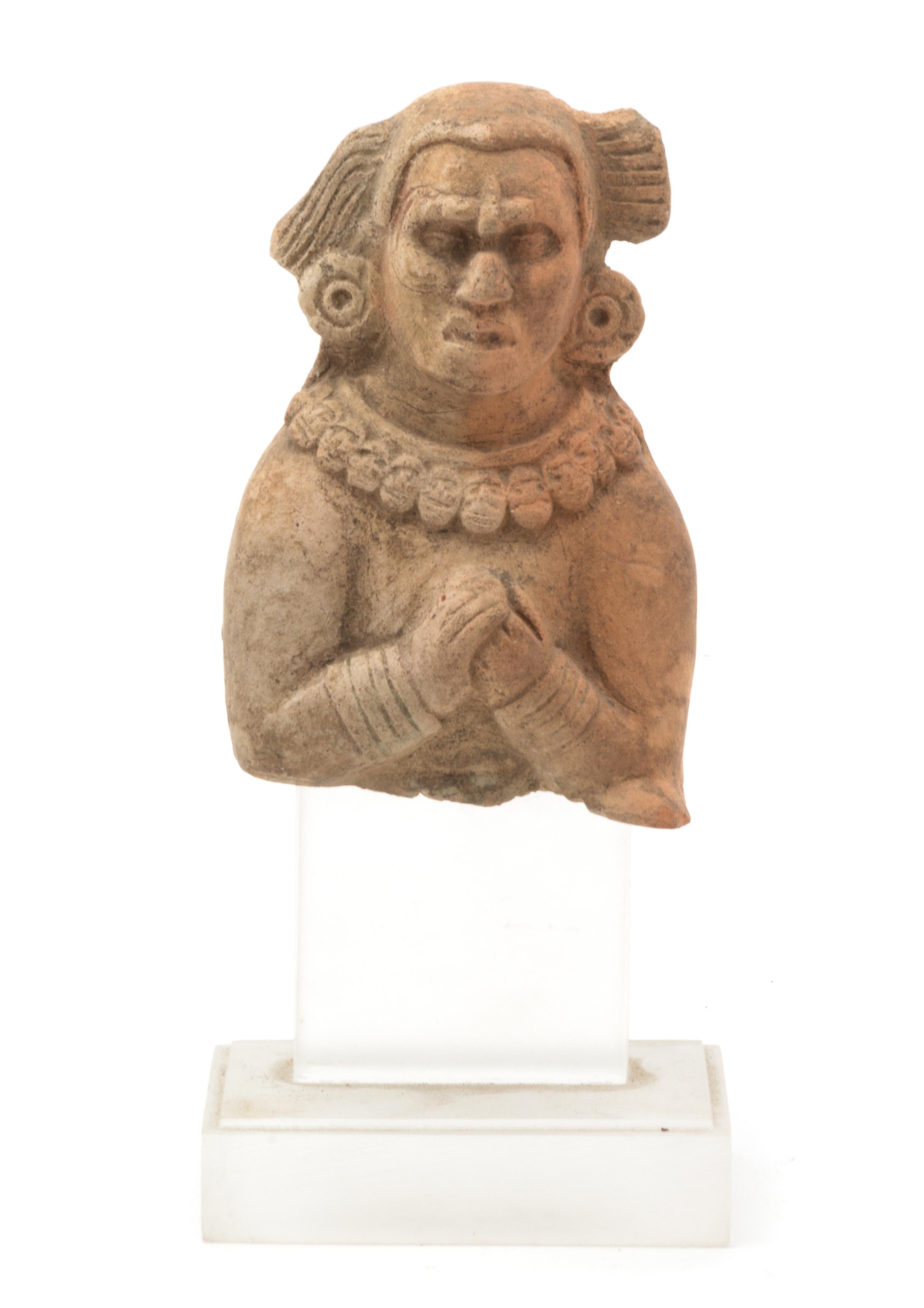 A Meso-American Ceramic Fragment Height 4 1/2 inches.