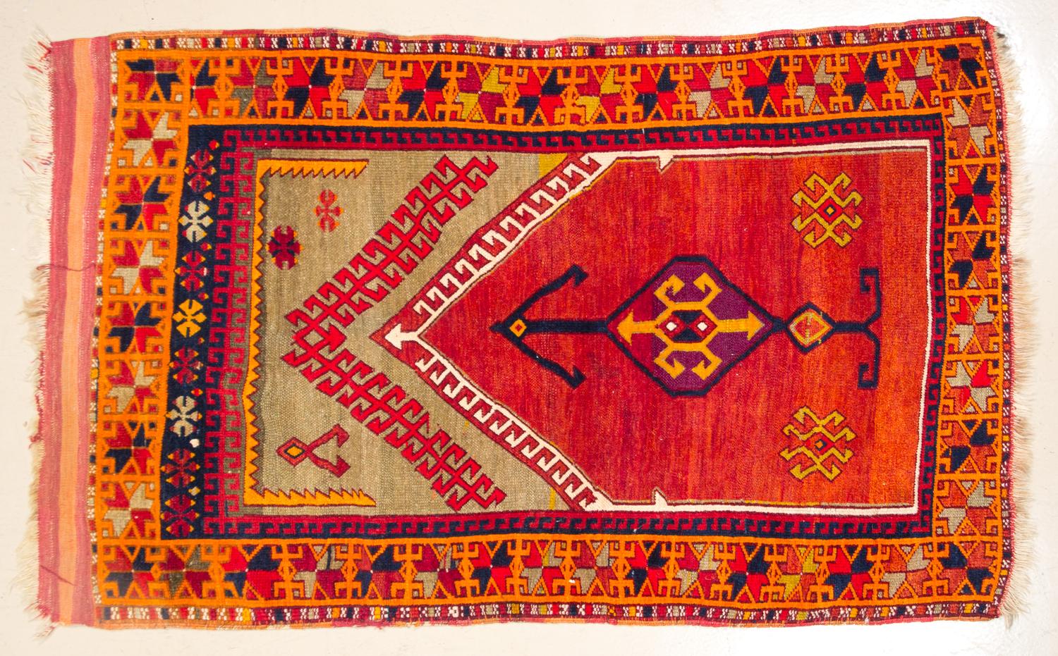 A Wool Prayer Rug 4 feet 6 inches x 3 feet 5 1/2 inches.