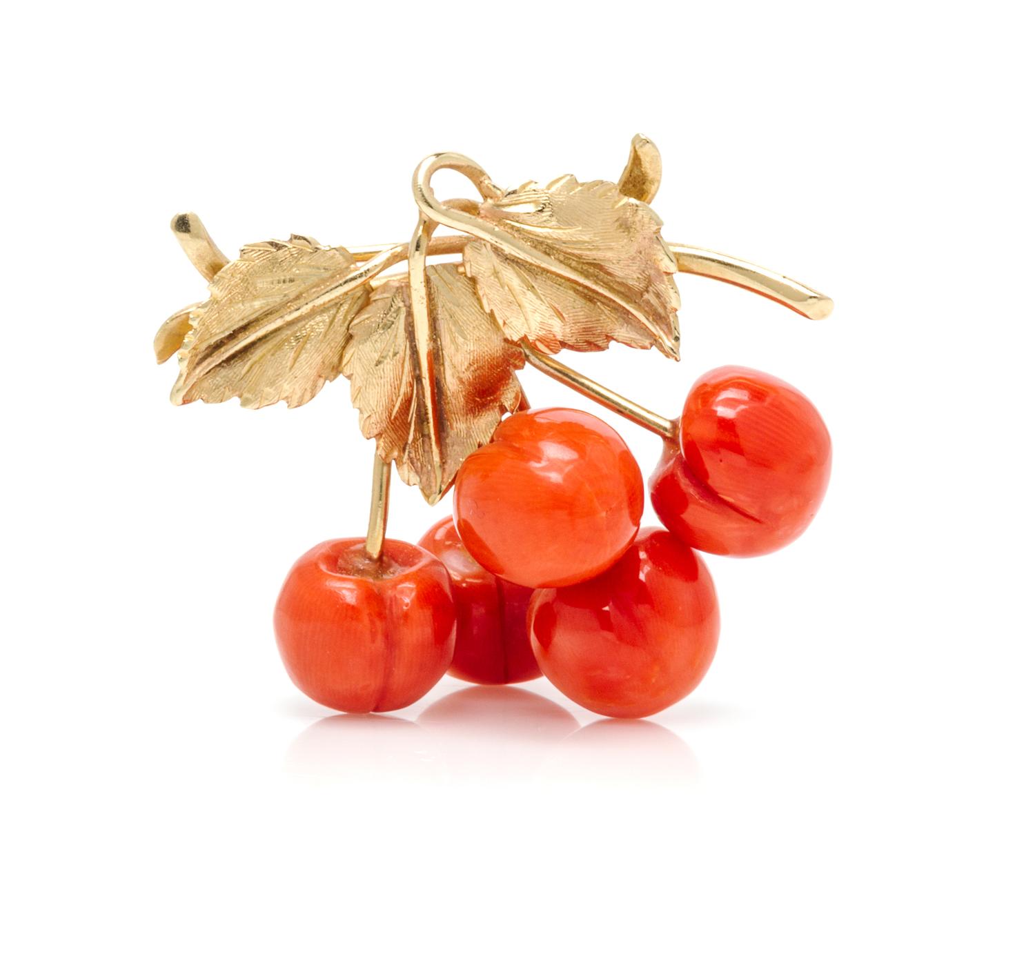 A Yellow Gold and Coral Brooch, 7.40 dwts.