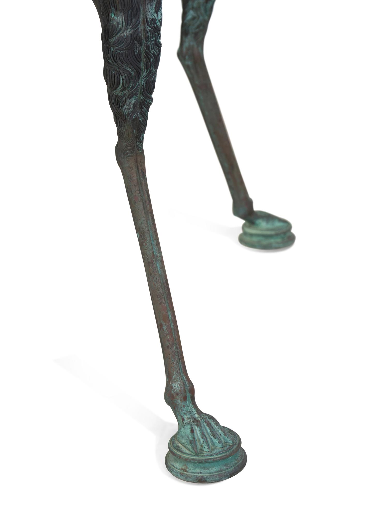 A Neoclassical Style Patinated Cast Metal Granite-Top Table