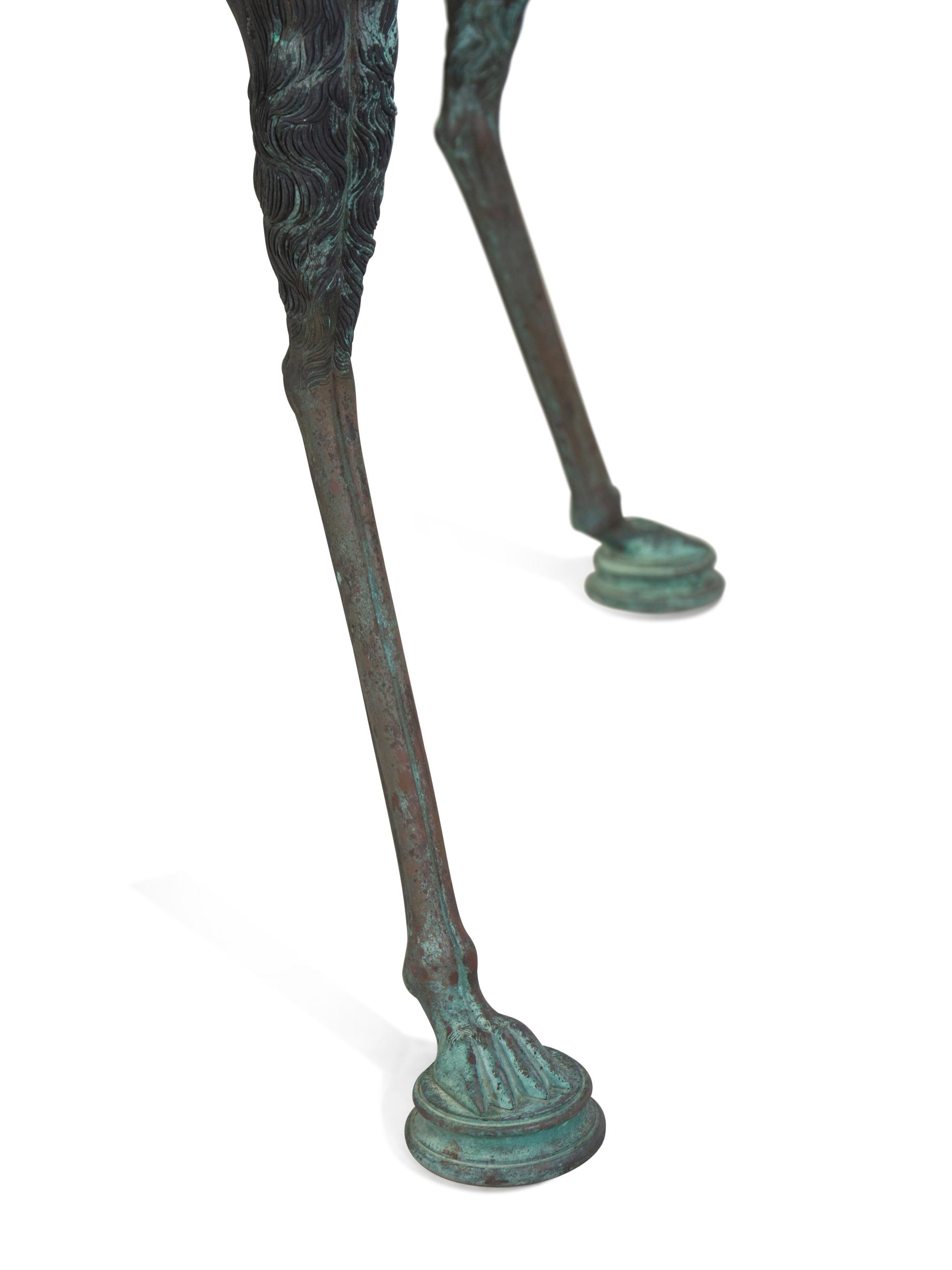 A Neoclassical Style Patinated Cast Metal Granite-Top Table