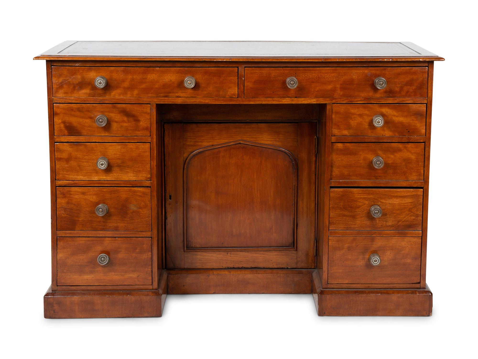 An English Mahogany Kneehole Desk — LATE 19TH CENTURY