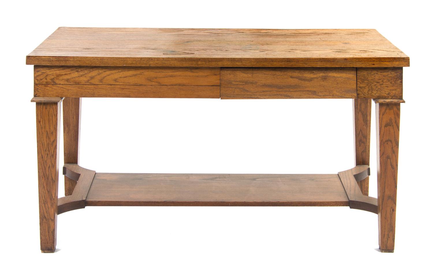An Arts and Crafts Style Oak Library Table, Height 29 1/2 x width 57 3/4 x depth 29 1/2 inches.