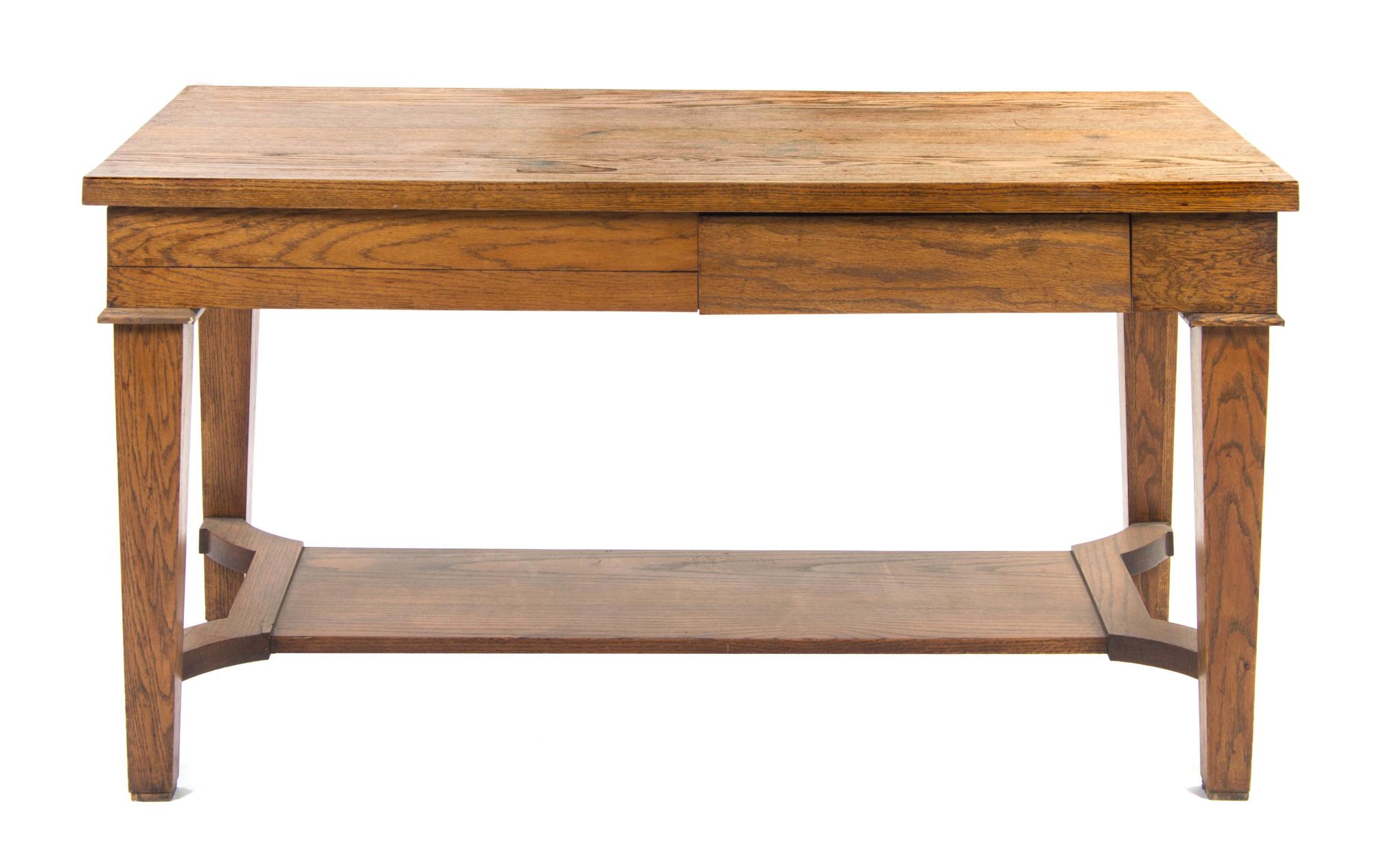 An Arts and Crafts Style Oak Library Table, Height 29 1/2 x width 57 3/4 x depth 29 1/2 inches.