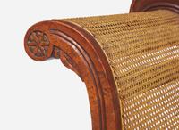 An Anglo-Colonial carved hardwood and caned sofa, first half 19th century