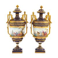 A Pair of Sèvres Style Gilt Bronze Mounted Porcelain Urns