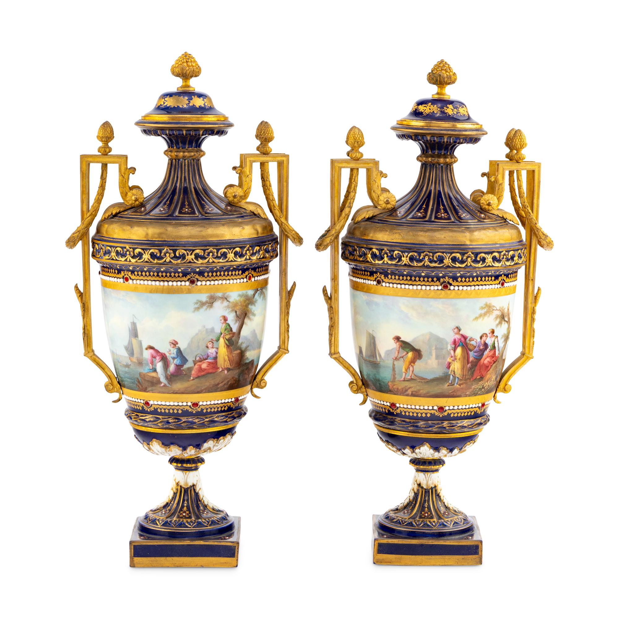 A Pair of Sèvres Style Gilt Bronze Mounted Porcelain Urns