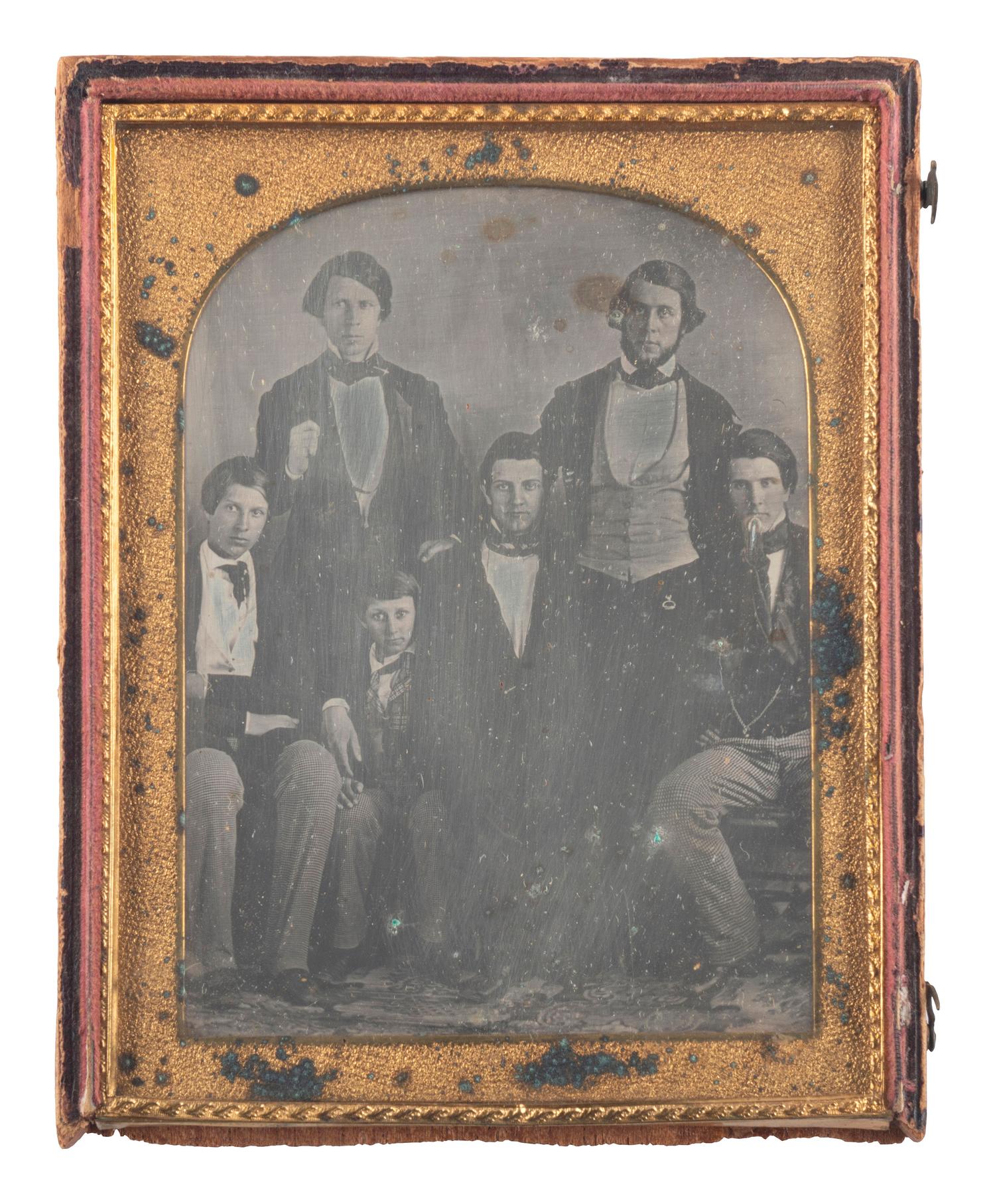 [EARLY PHOTOGRAPHY]. A group of 3 half plate daguerreotypes of large groups, incl. identified family of 5 from Maine.