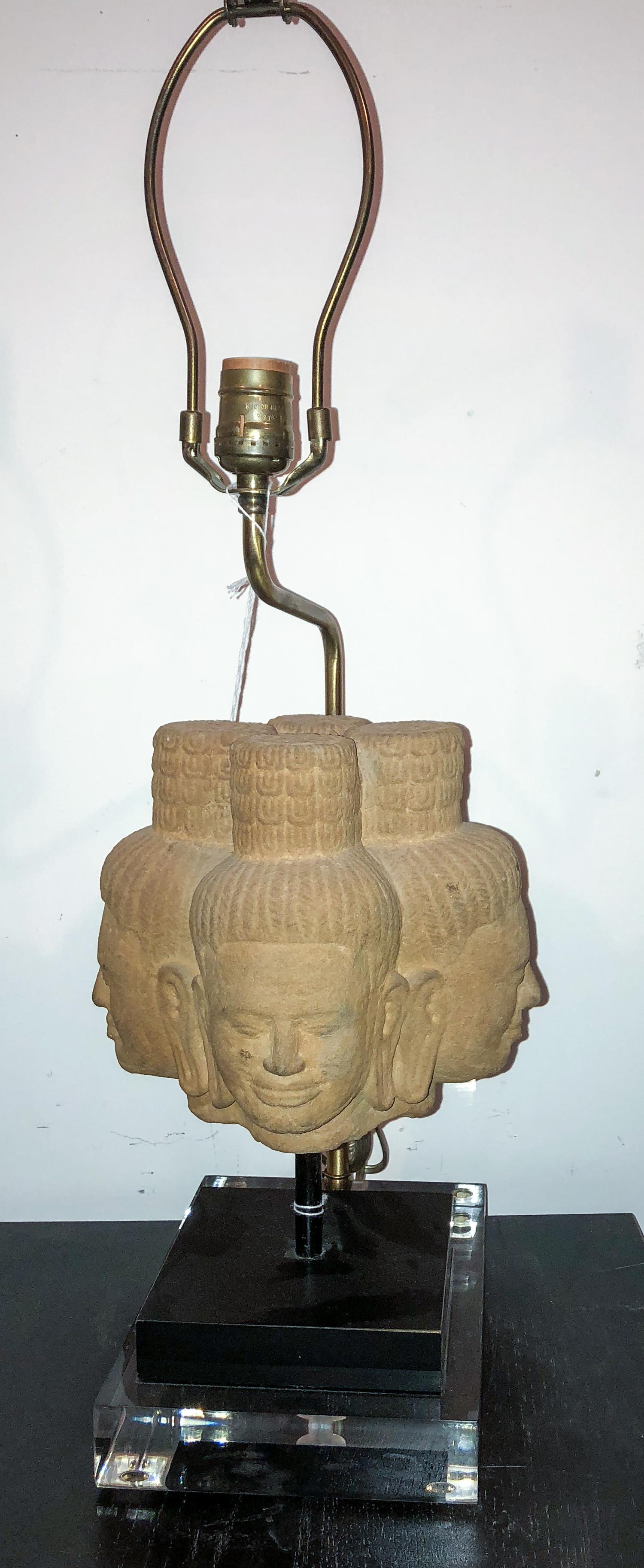 A Khmer Style Carved Sandstone Group Height of stone 7 1/2 x width 9 inches.