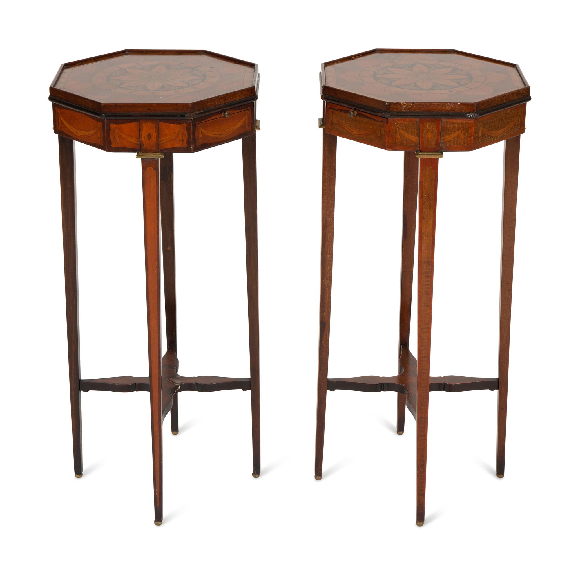 A Pair of George III Style Mahogany Candle Stands