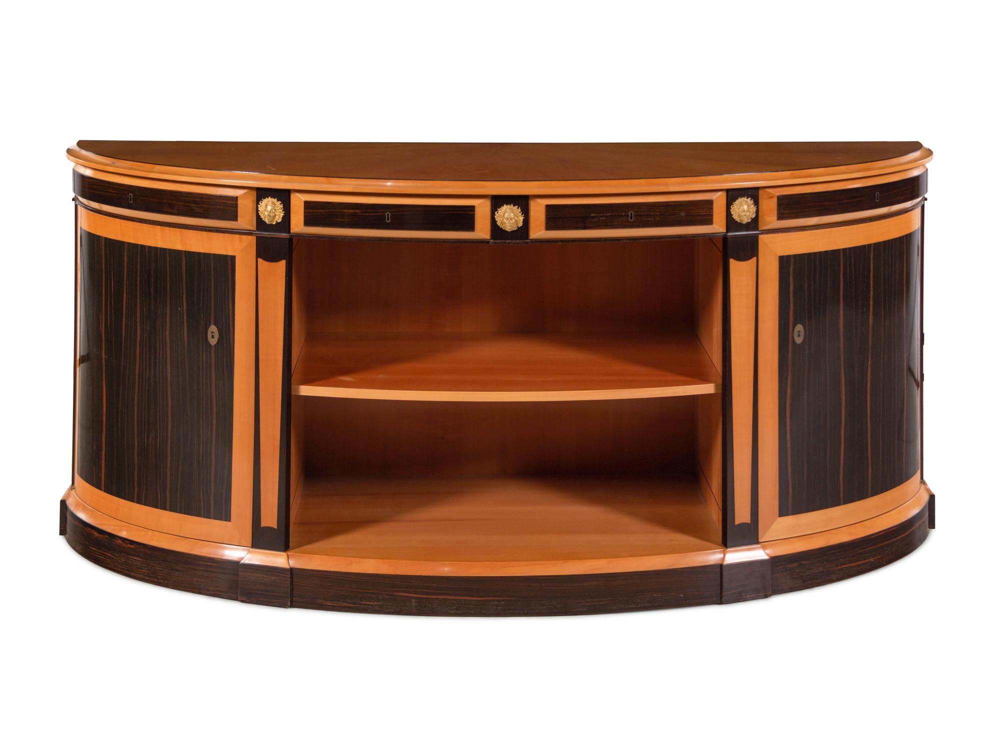 A Custom Gilt Bronze Mounted Part-Ebonized Satinwood Demilune Cabinet