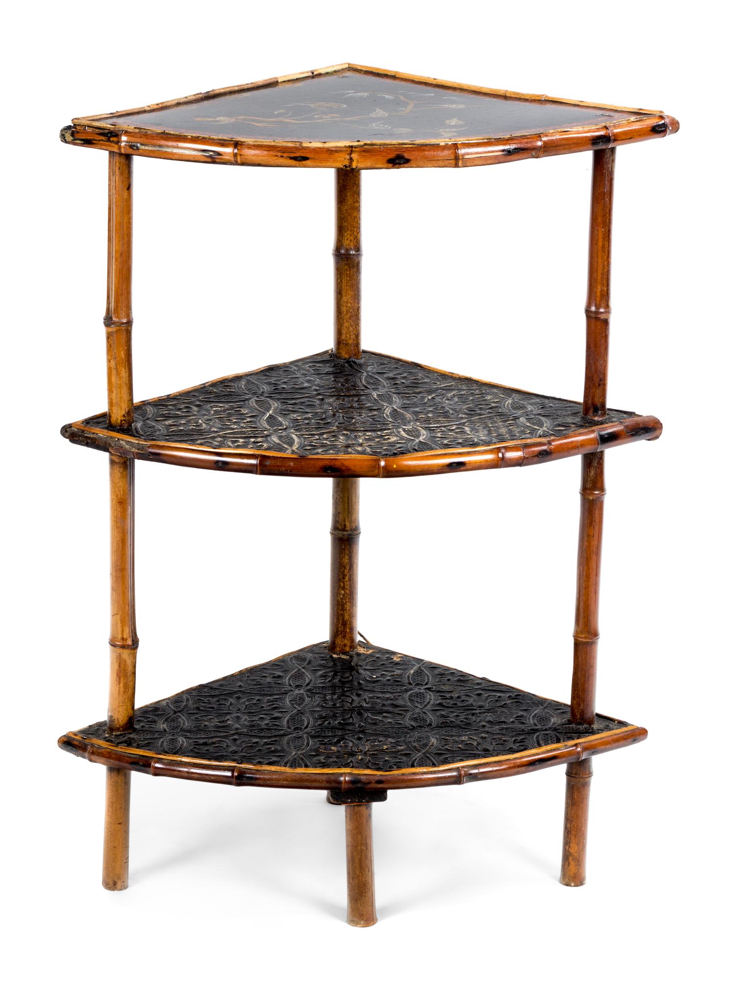 A Victorian Black Lacquered and Bamboo Three-Tiered Corner Etagere Height 32 x width 16 x depth 16 inches.