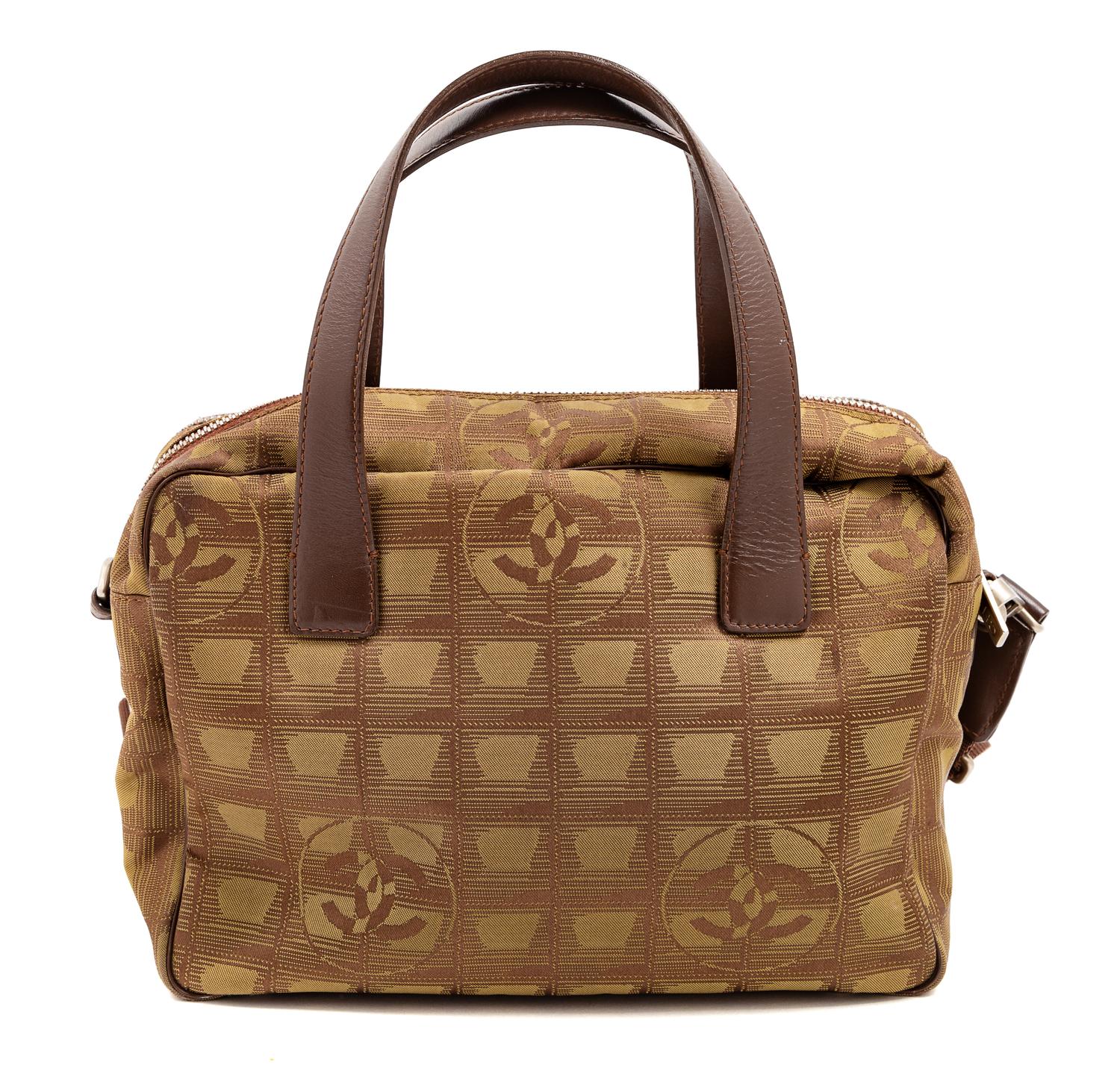 A Chanel Brown Nylon Travel Line Handbag, 8" H x 10" W x 4" D; Handle drop: 4.5".