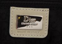 A Christian Dior Cream Denim Saddle Handbag, 10" x 8" x 2.25".