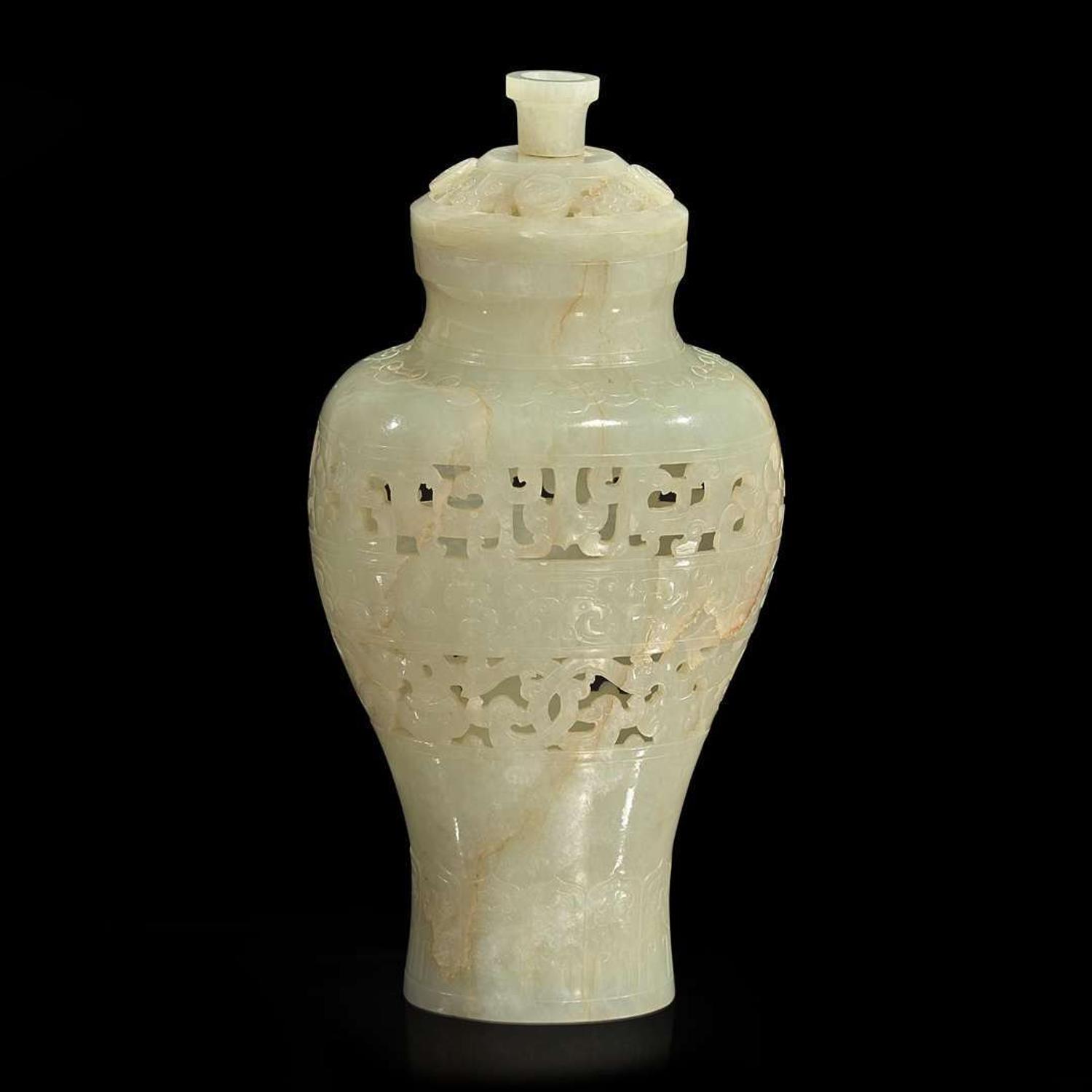 A Chinese carved pale celadon jade reticulated vase and cover 透雕青白玉盖樽 Qing dynasty ?