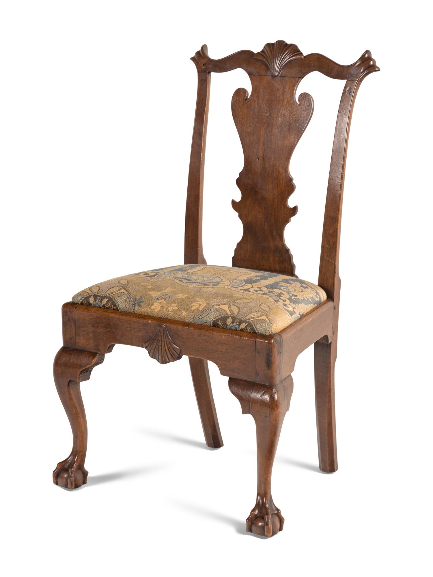 A Group of Four Chippendale Carved Walnut Side Chairs