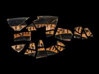 18 Attic Black-Figured Band Cup Fragments with Warriors and Sphinxes