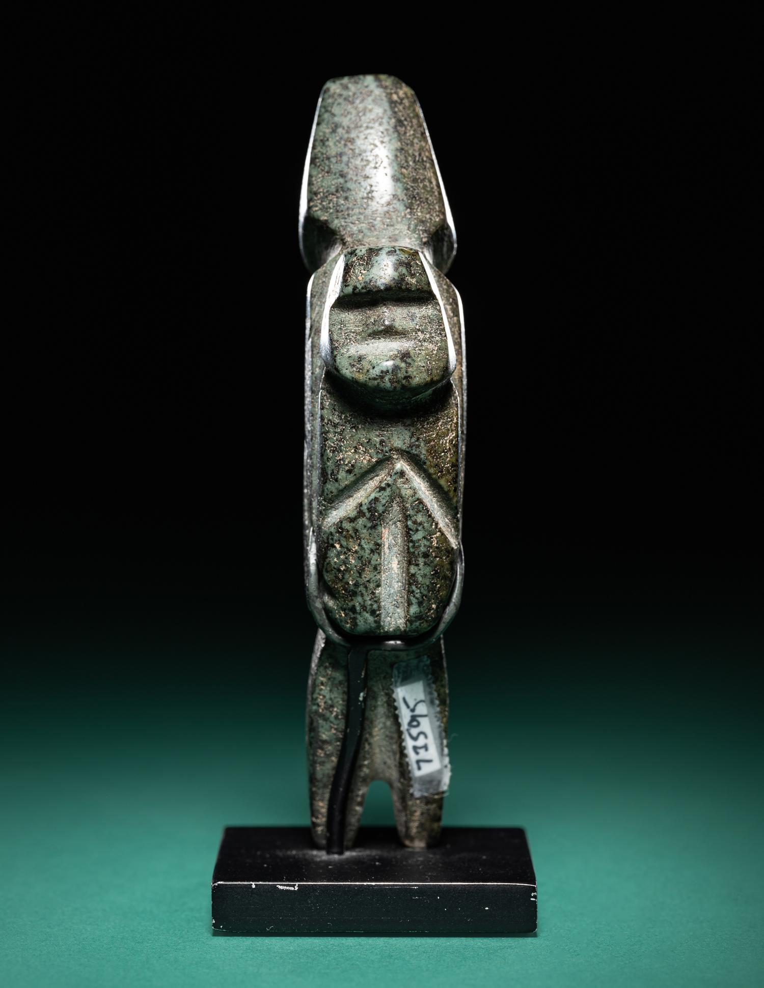 A Mezcala Diorite Standing Figure with an Infant