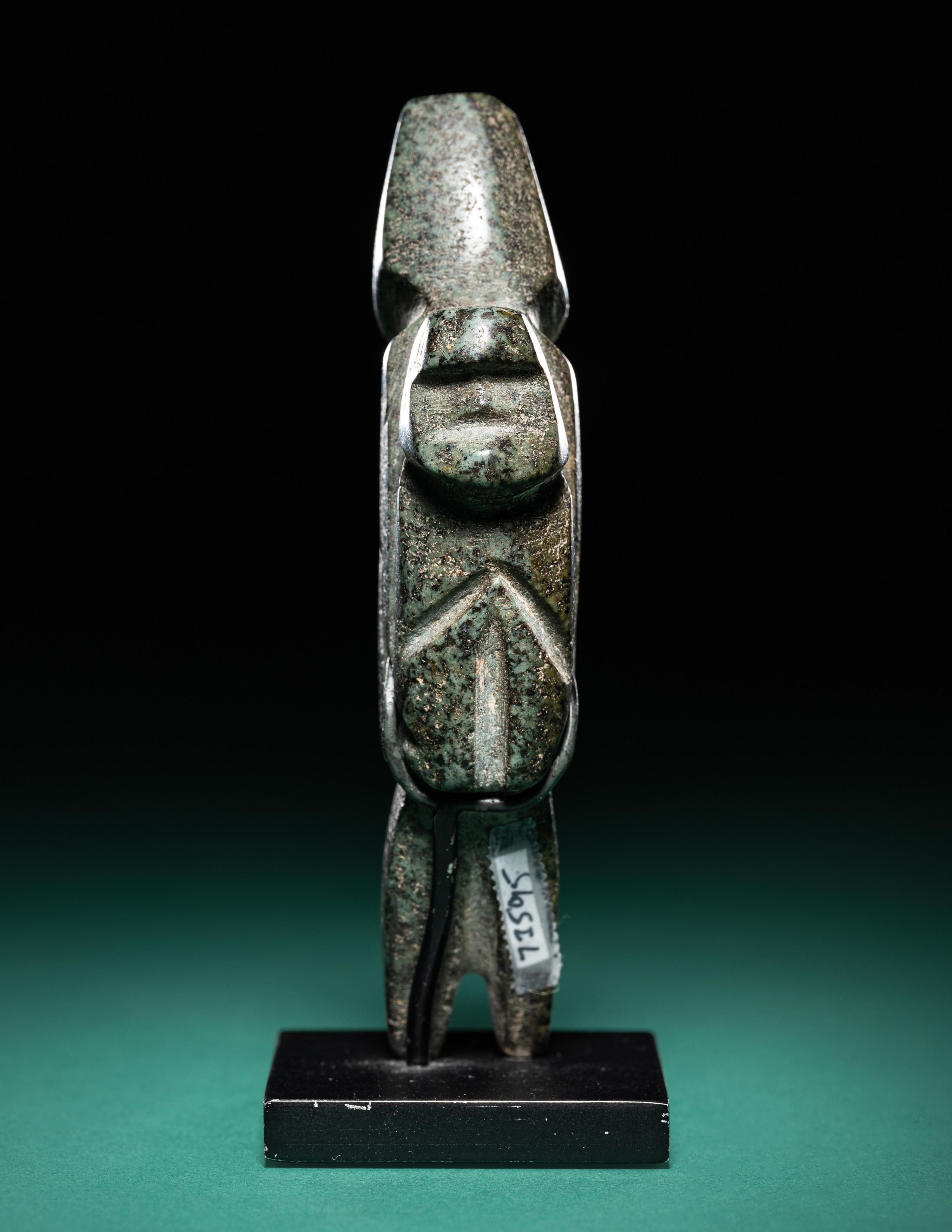 A Mezcala Diorite Standing Figure with an Infant