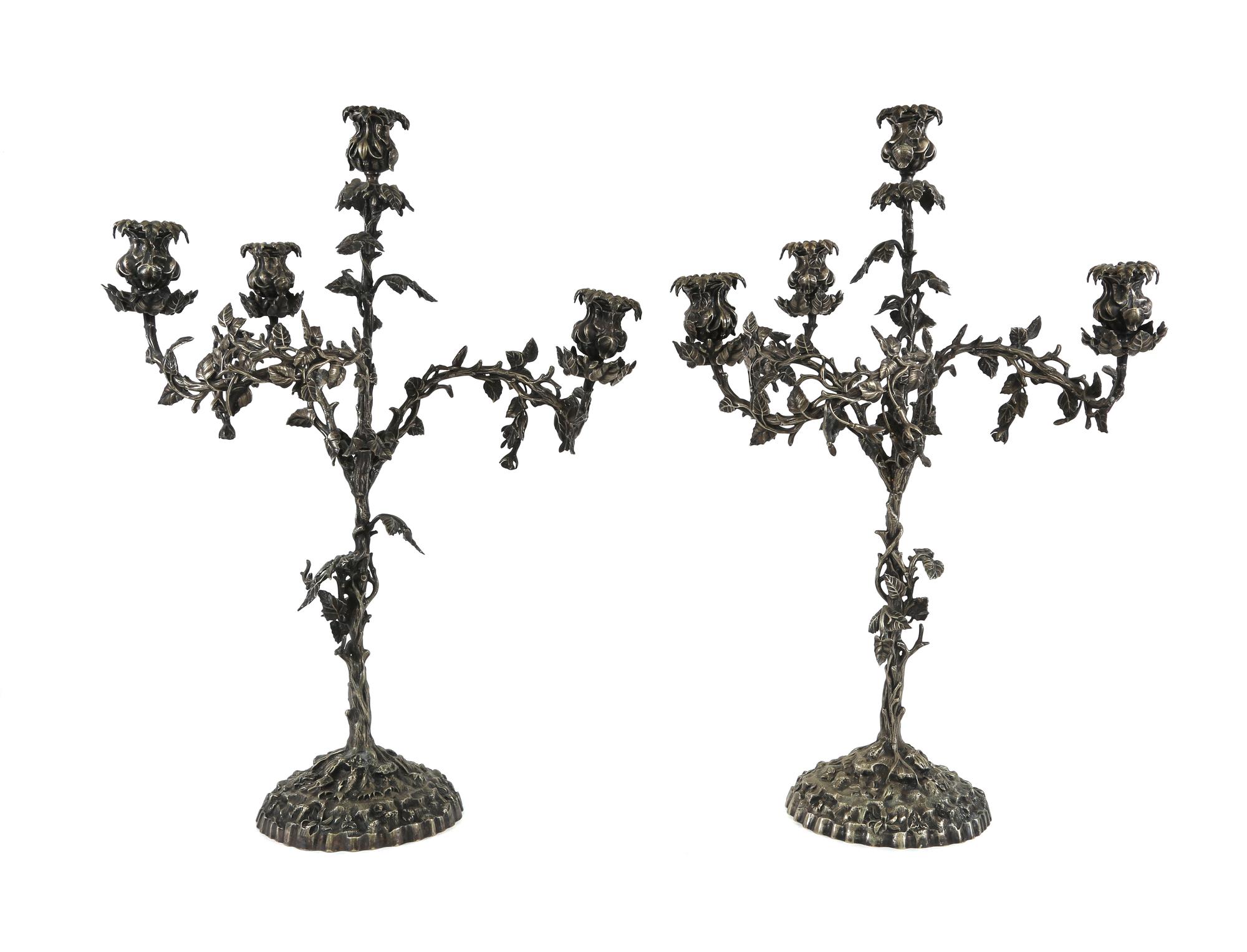 A Pair of Continental Silver-Plate Four-Light Candelabra Height 25 inches. — 19TH CENTURY
