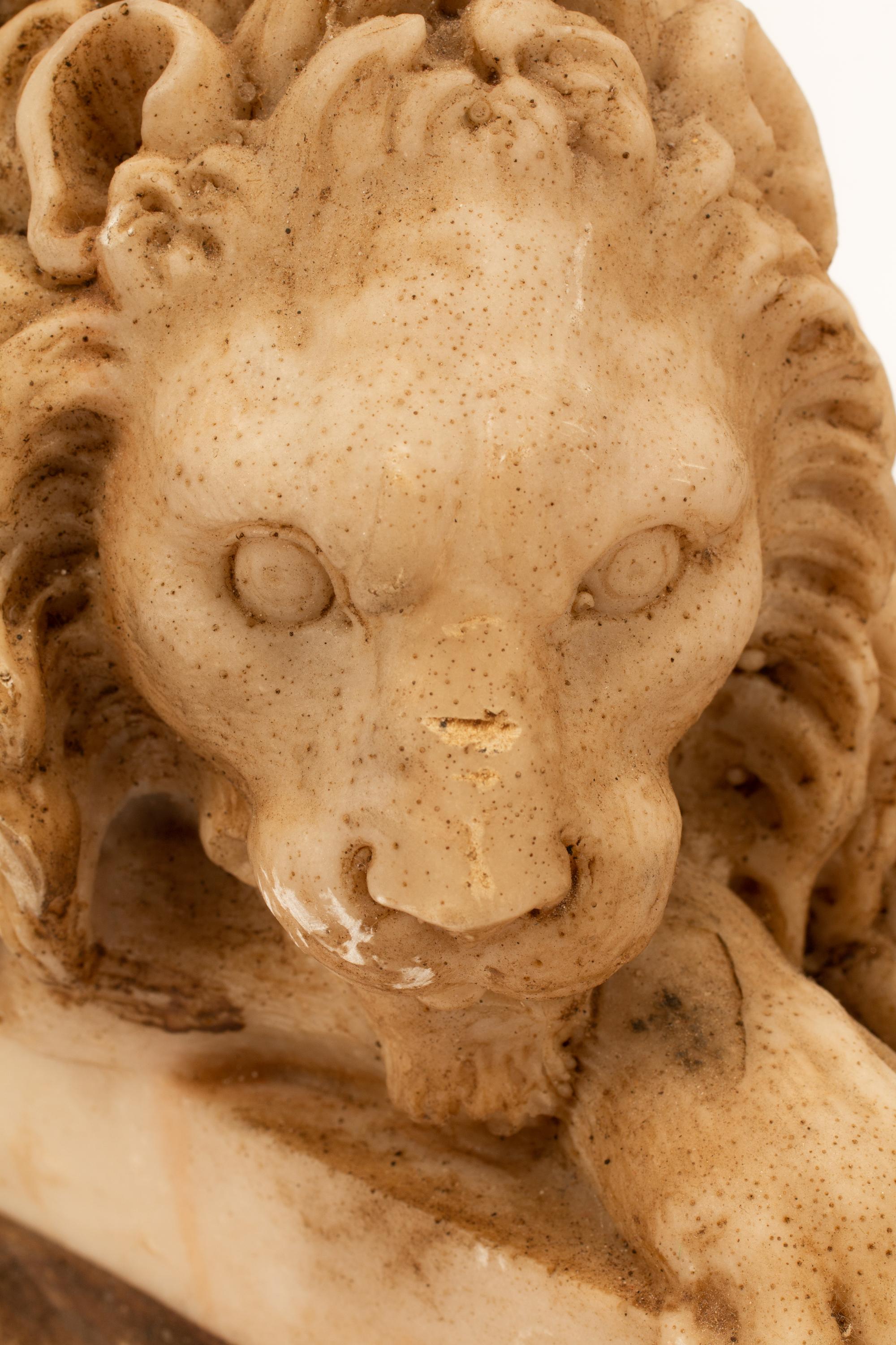 A Pair of Composite Marble Models of Reclining Lions