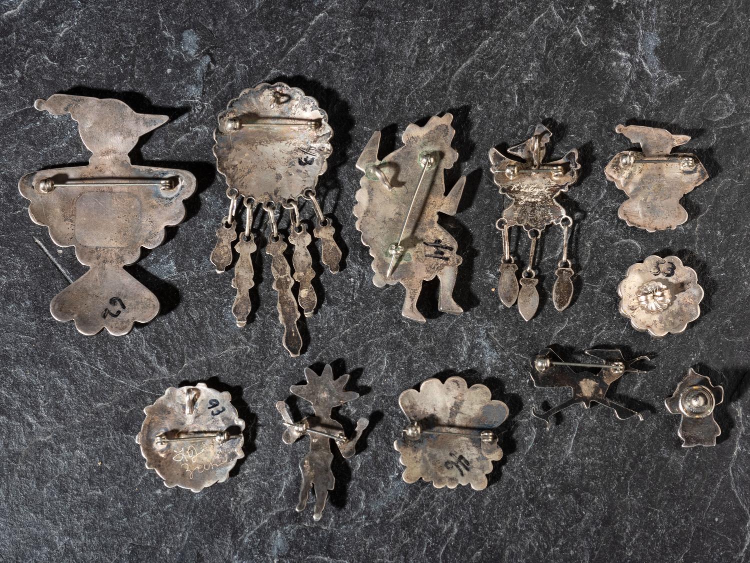 An Assortment of Zuni Mosaic Inlay Pins / Pendants