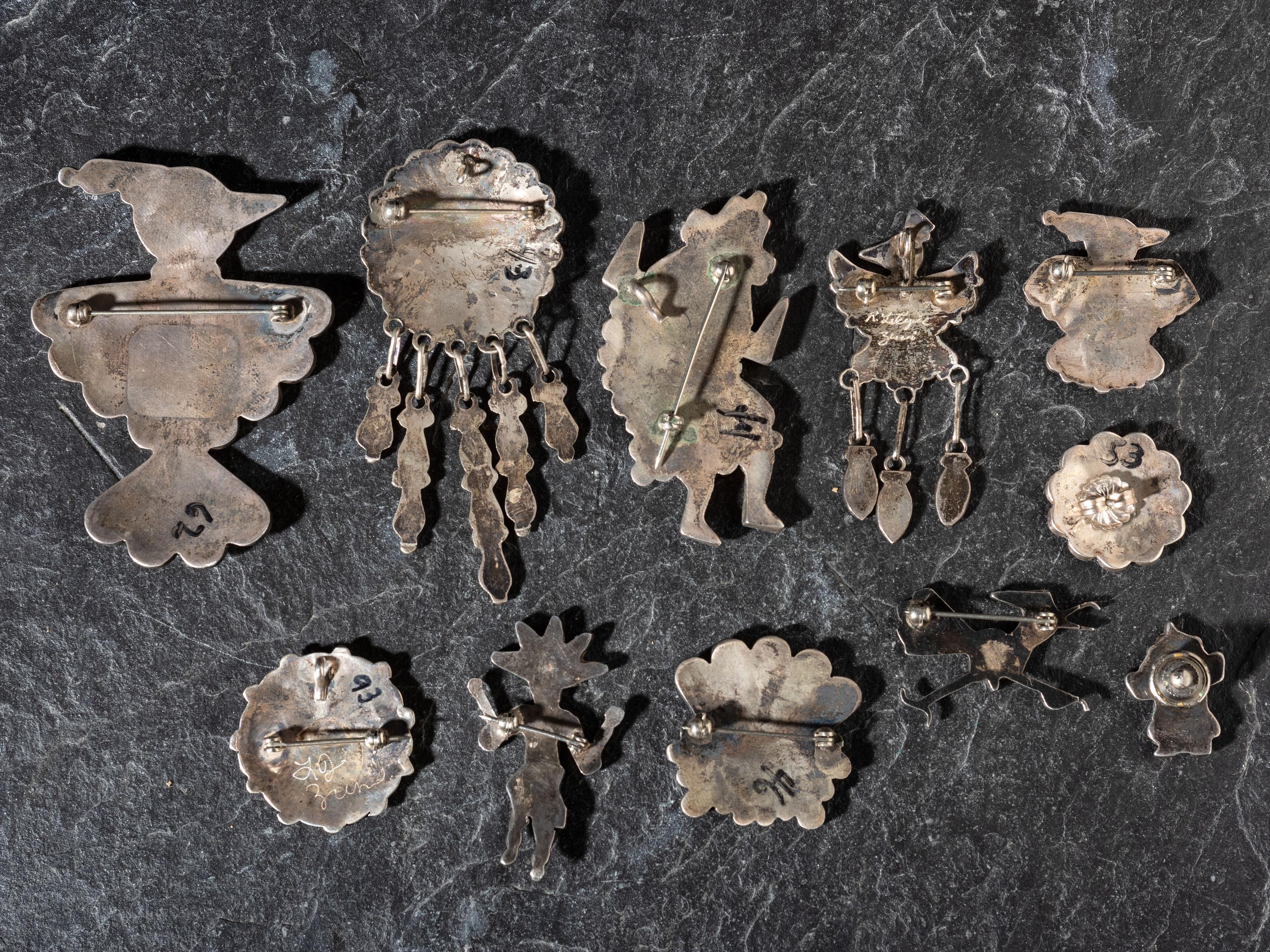 An Assortment of Zuni Mosaic Inlay Pins / Pendants