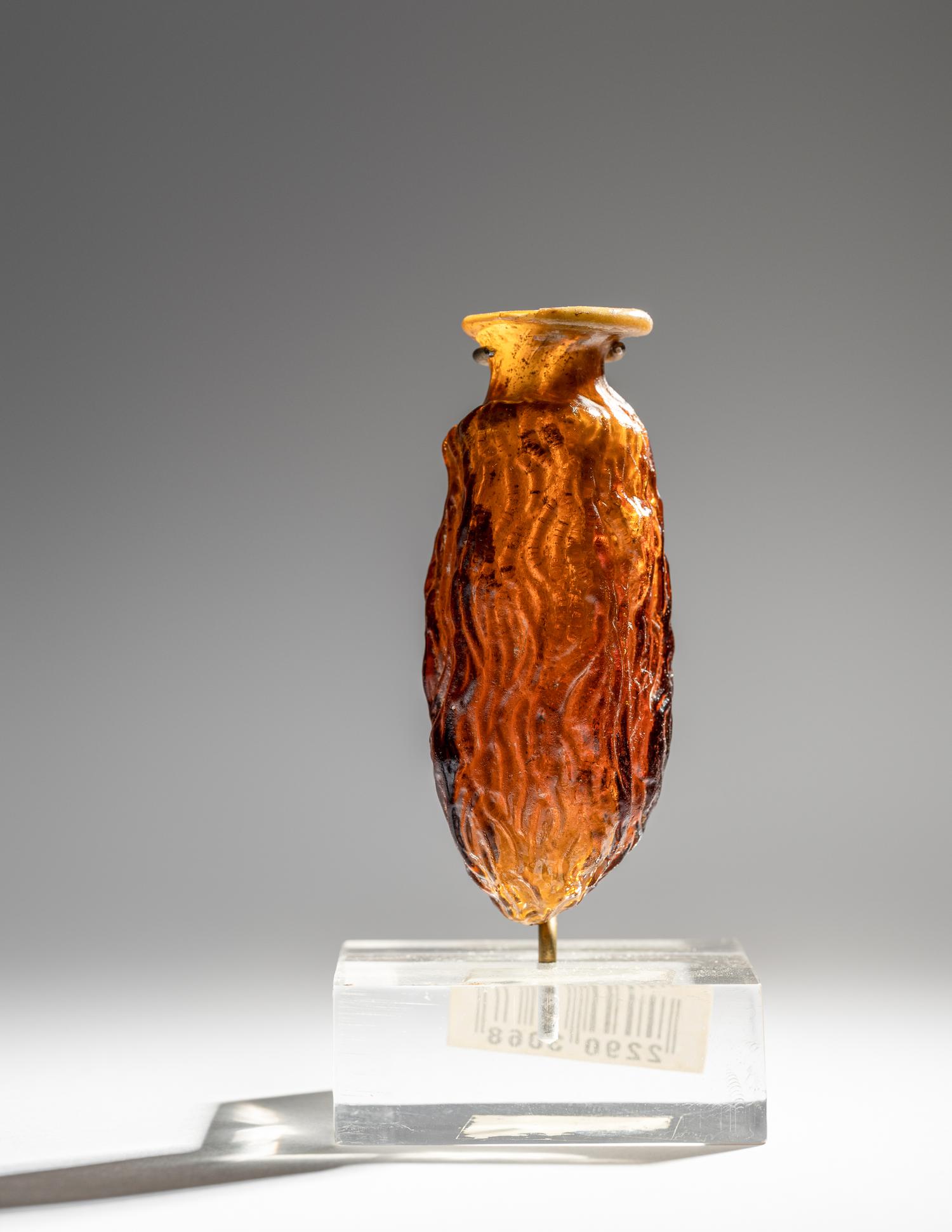 A Roman Amber Glass Date Flask