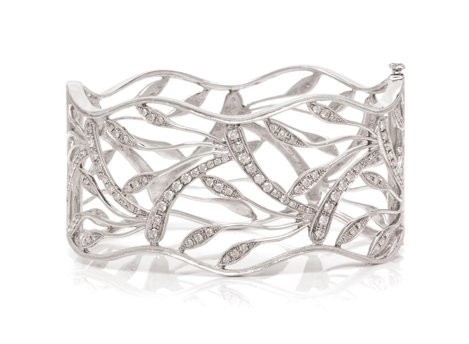 A White Gold and Diamond Openwork Bangle Bracelet, 25.80 dwts.