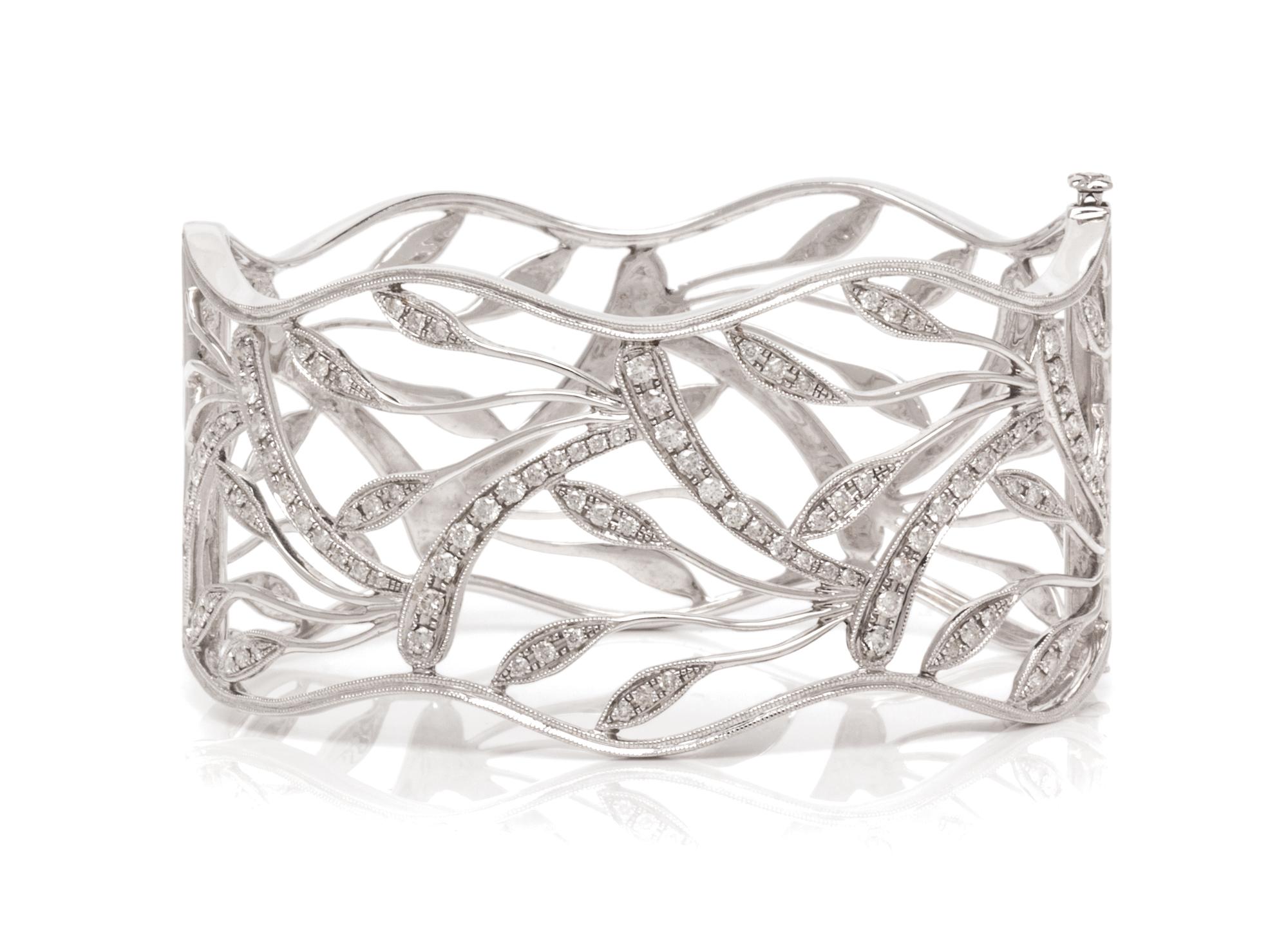 A White Gold and Diamond Openwork Bangle Bracelet, 25.80 dwts.