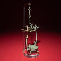 A Chinese Bronze 'Phoenix and Immortal' Hanging Oil Lamp, Eastern Han Dynasty — 東漢 青銅龍鳳神人懸燈