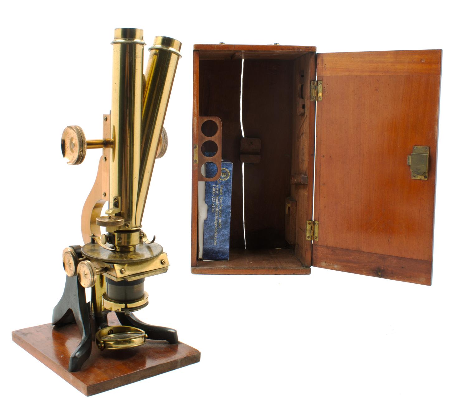 An English Brass and Black Lacquered Binocular Microscope Height 13 1/4 inches. — LOFTUS, LONDON, EARLY 20TH CENTURY