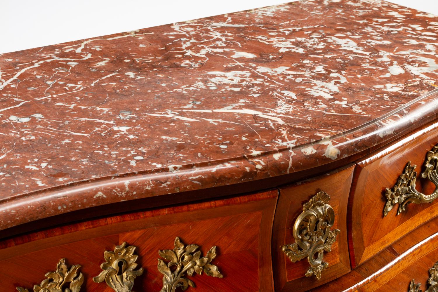 A Régence Style Gilt Bronze Mounted Kingwood Marble-Top Commode