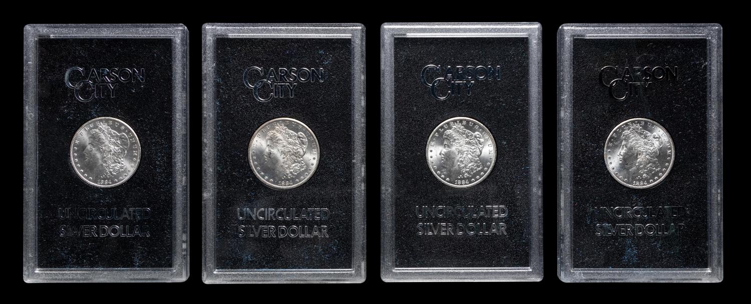 A Group of Eight 1884-CC GSA: Morgan $1 Coins