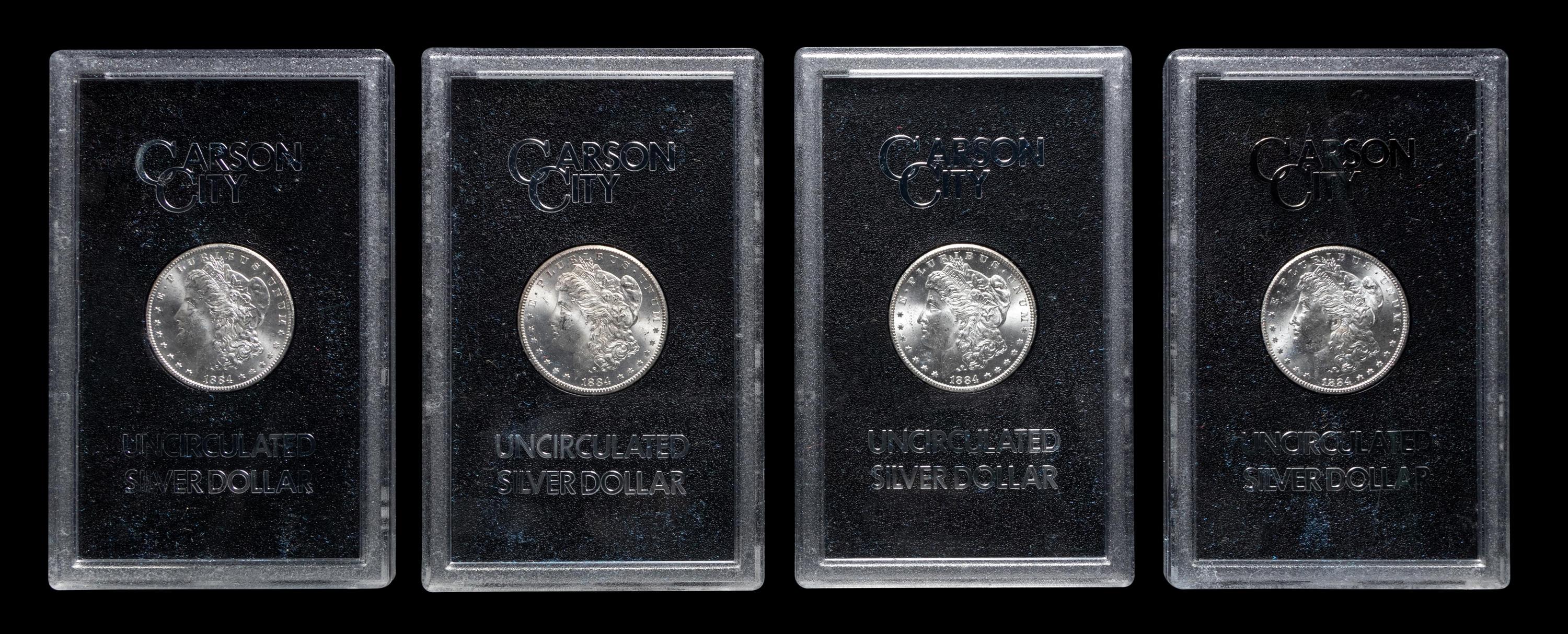 A Group of Eight 1884-CC GSA: Morgan $1 Coins