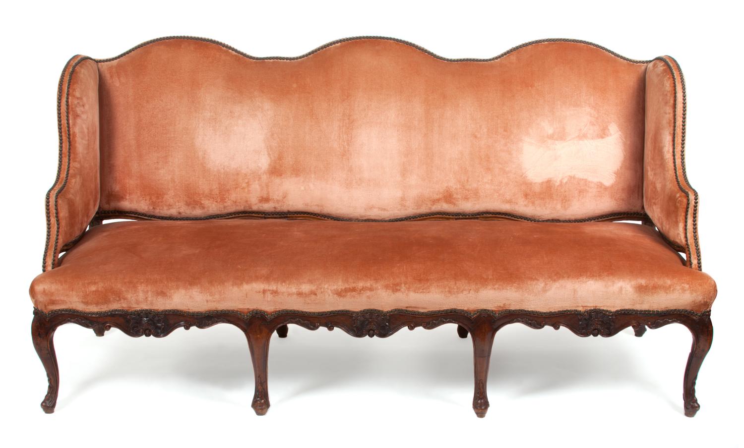 A French Relief Carved Settee Height 37 x width 75 1/2 x depth 26 inches.