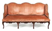 A French Relief Carved Settee Height 37 x width 75 1/2 x depth 26 inches.
