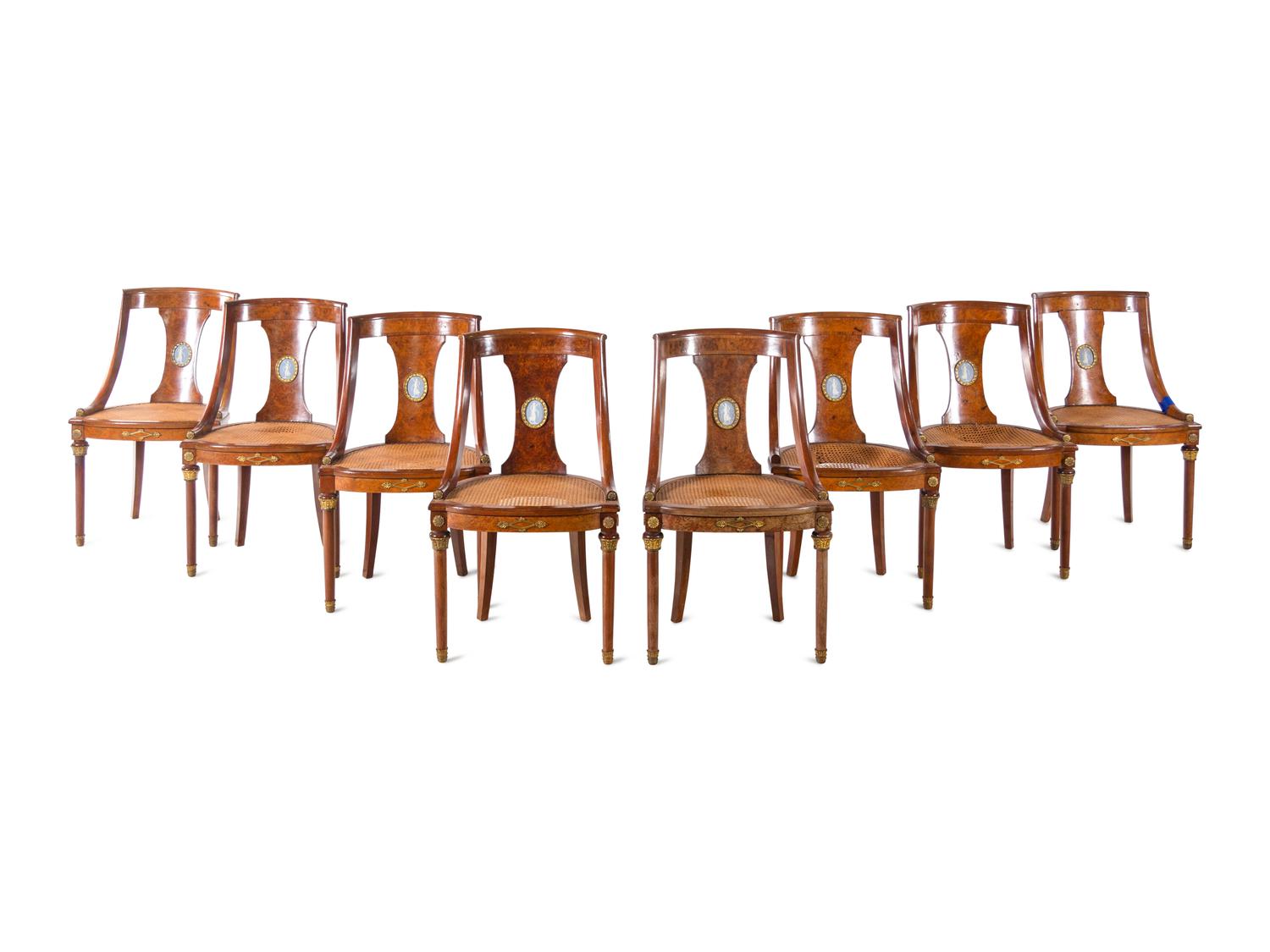 A French Gilt Bronze and Jasperware Mounted Burlwood Dining Suite