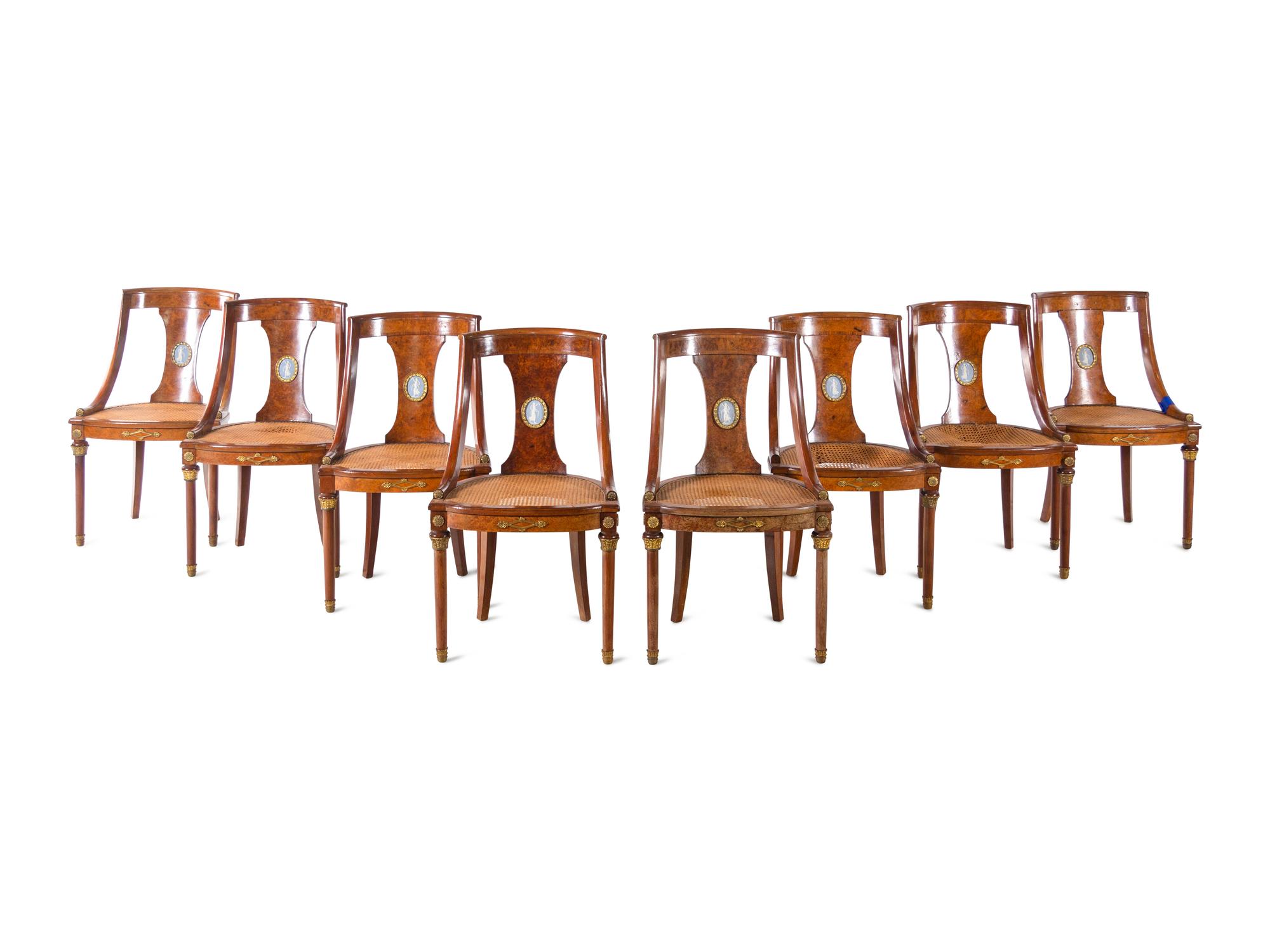 A French Gilt Bronze and Jasperware Mounted Burlwood Dining Suite