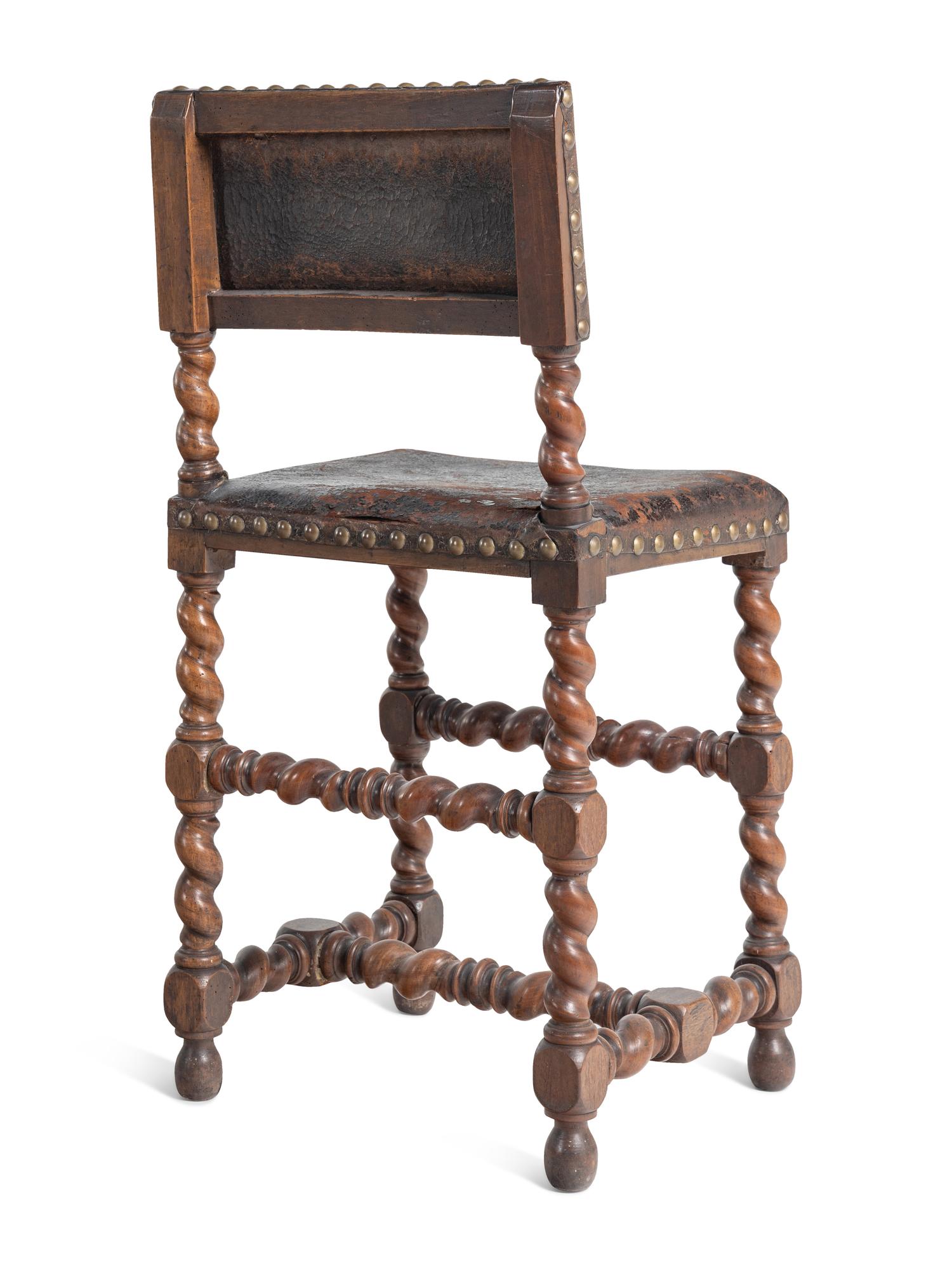 A Set of Six Spanish Baroque Style Walnut Dining Chairs