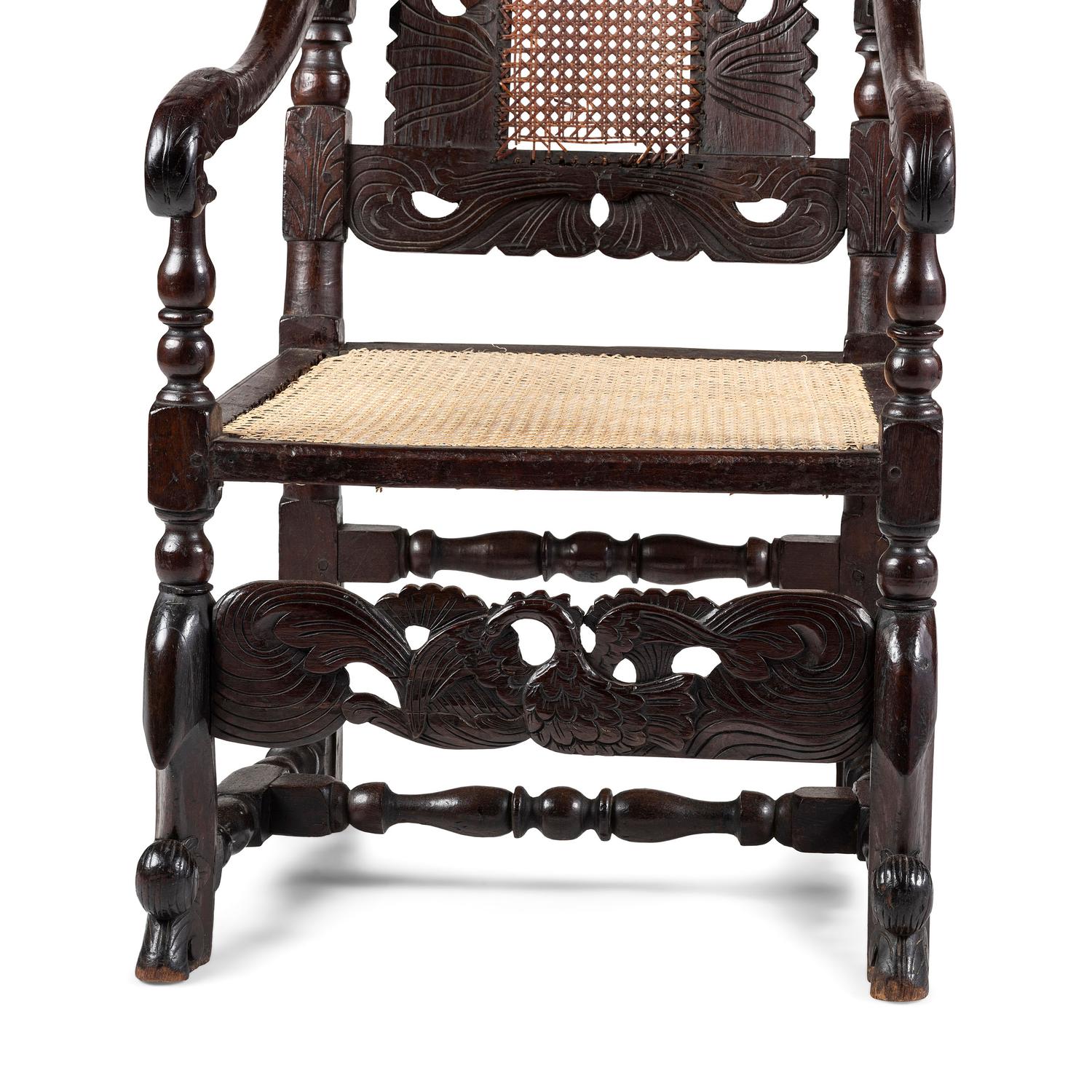 A William and Mary Swan-and-Leaf Carved and Cane Upholstered Oak Armchair